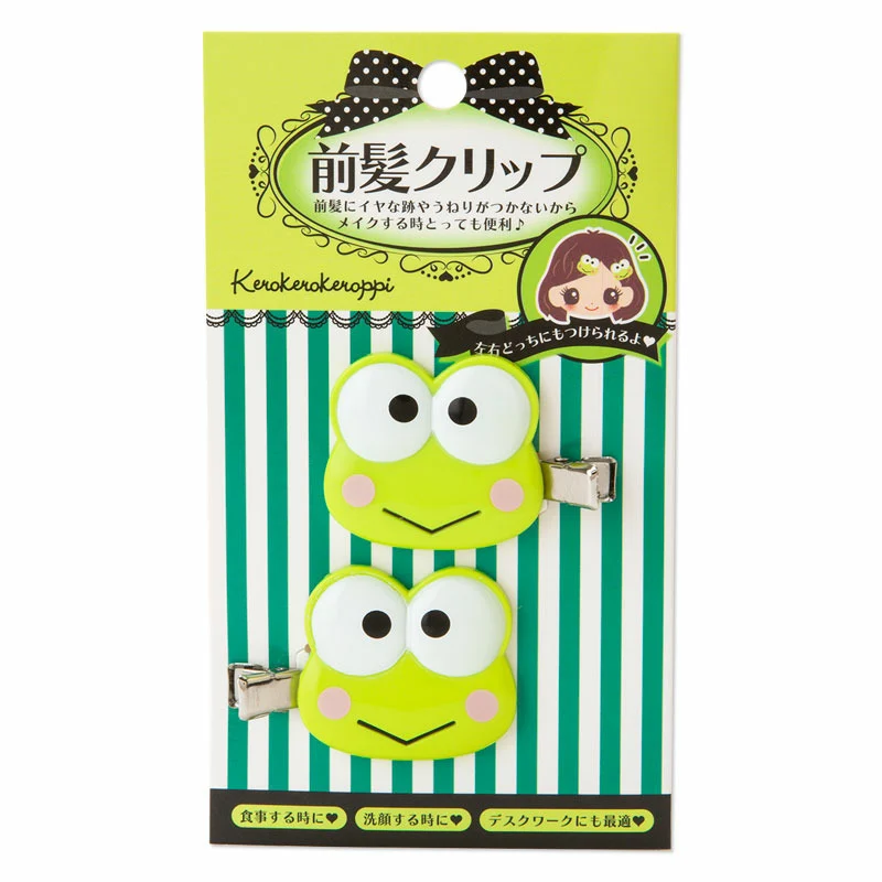 A girl using the Keroppi hair clips to keep her hair back while smiling, demonstrating their practical use.