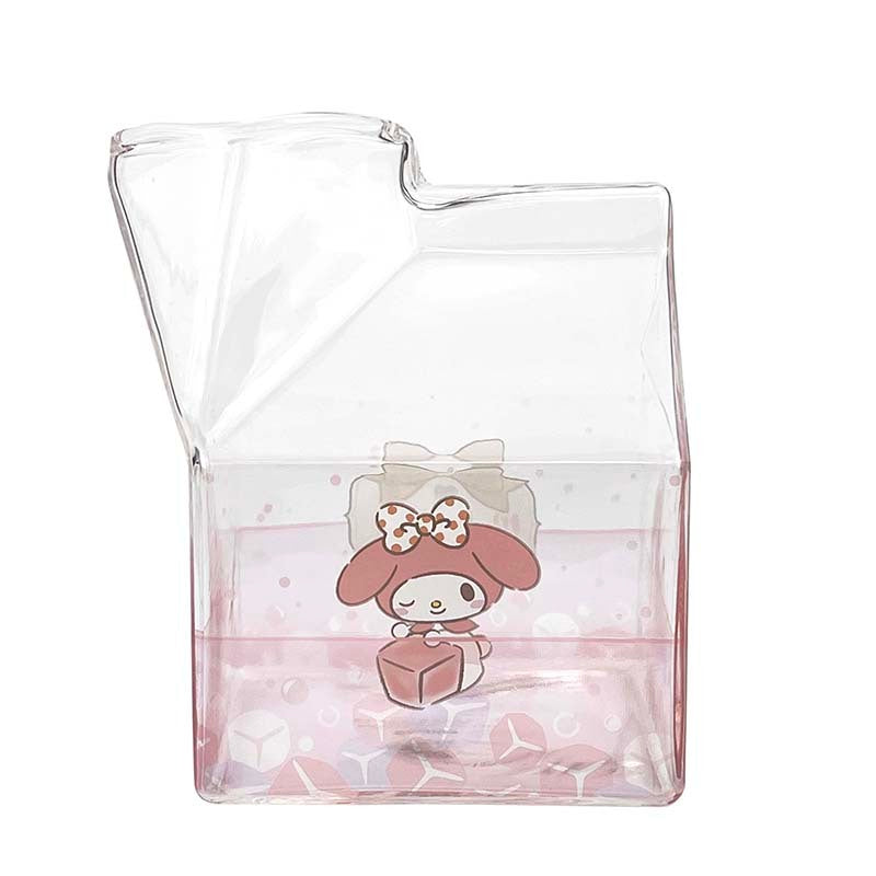 Close-up of Hello Kitty milk carton cup on a colorful table.