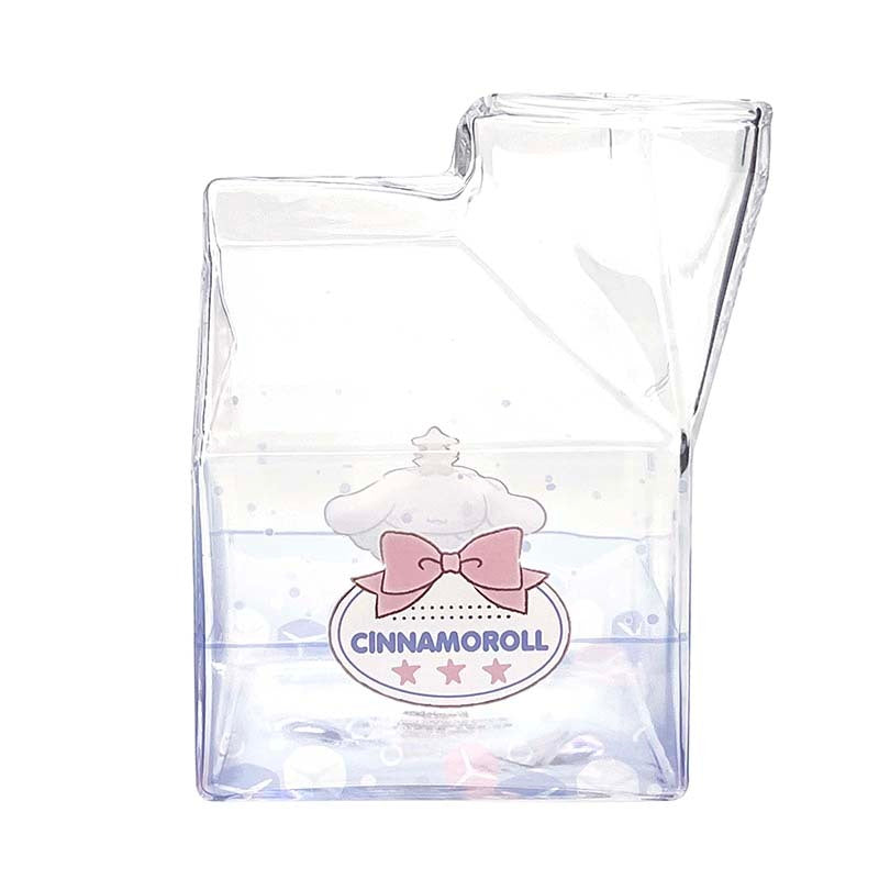 Milk carton cup with peach iced tea against a pastel backdrop