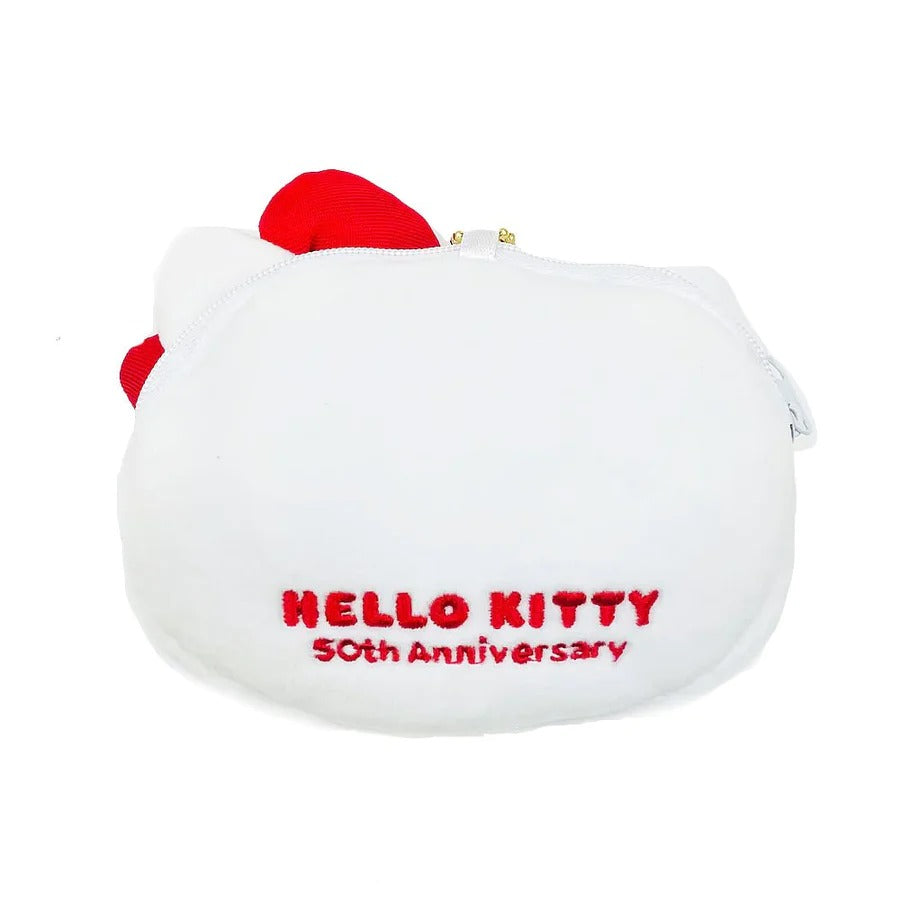 Tote bag folded neatly with plush charm attached, shown on a table