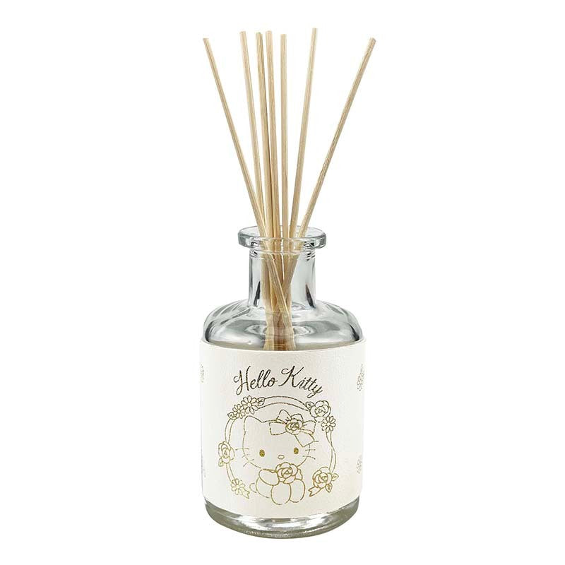 Hello Kitty glass diffuser with floral artwork on a bedroom shelf