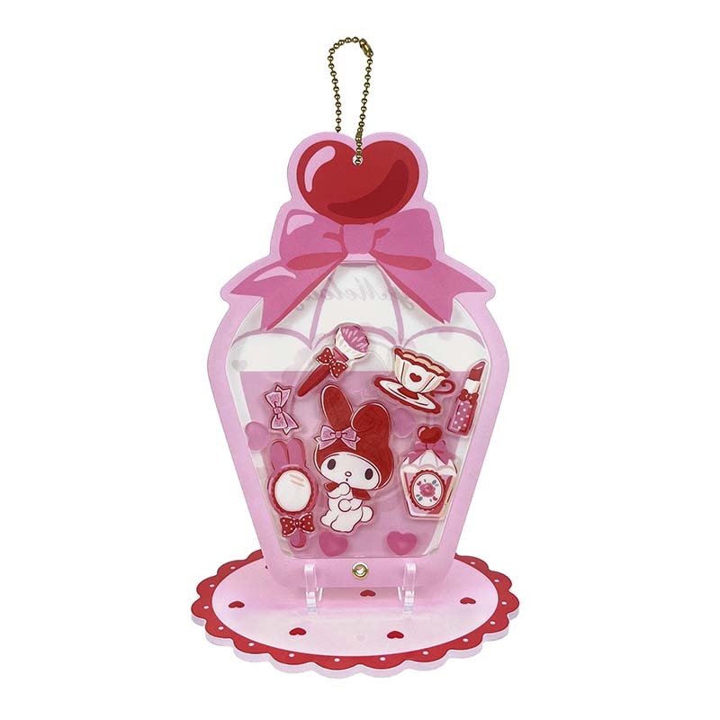My Melody keychain displayed with colorful floating charms and a stand