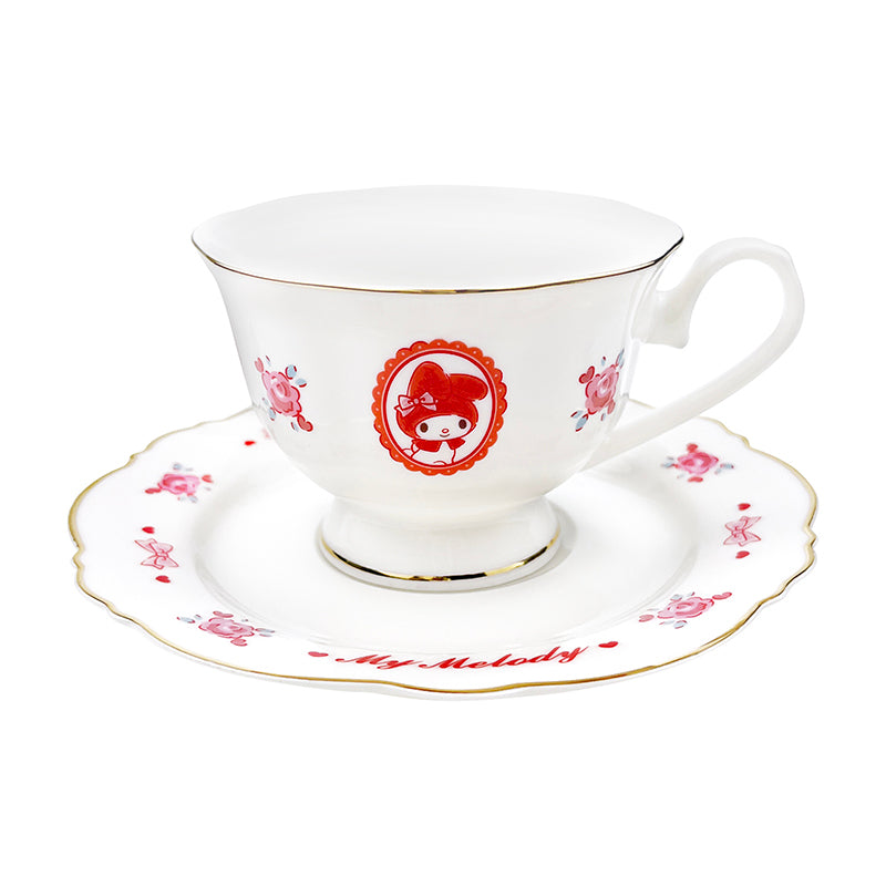 My Melody ceramic tea cup with pink bow and red hood design on a white table