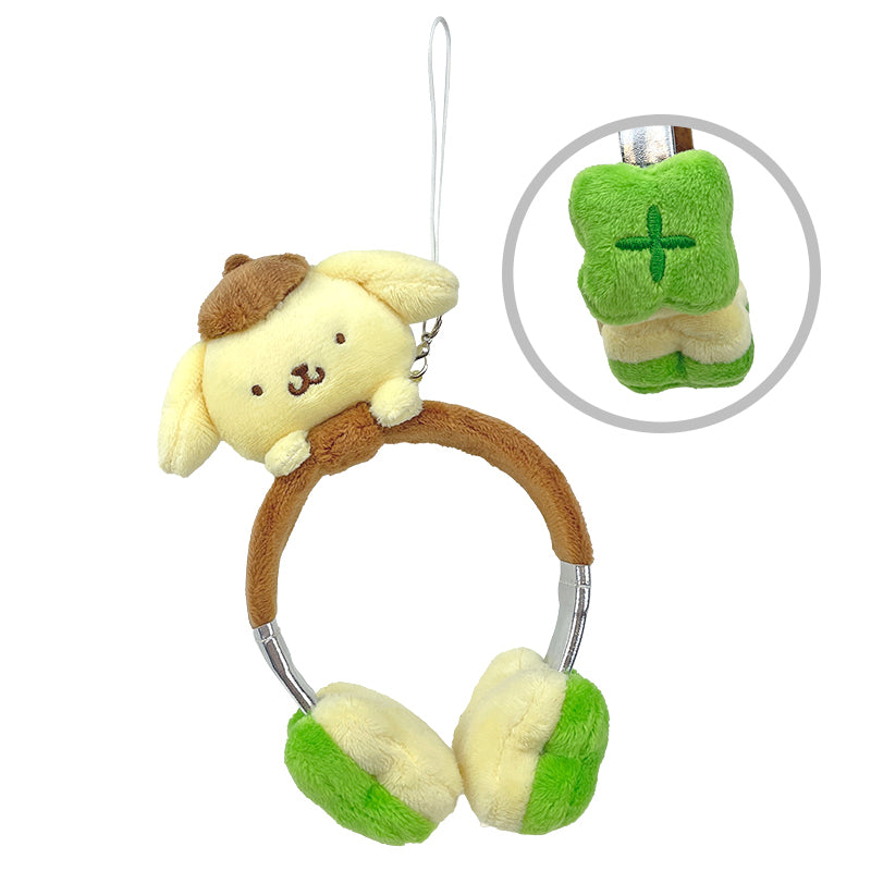 Close-up of Pompompurin plush headphones bag charm on a denim tote