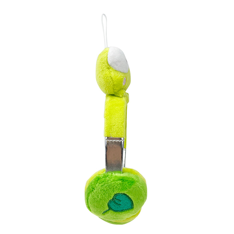 Adorable giant Keroppi plush displayed next to headphones.