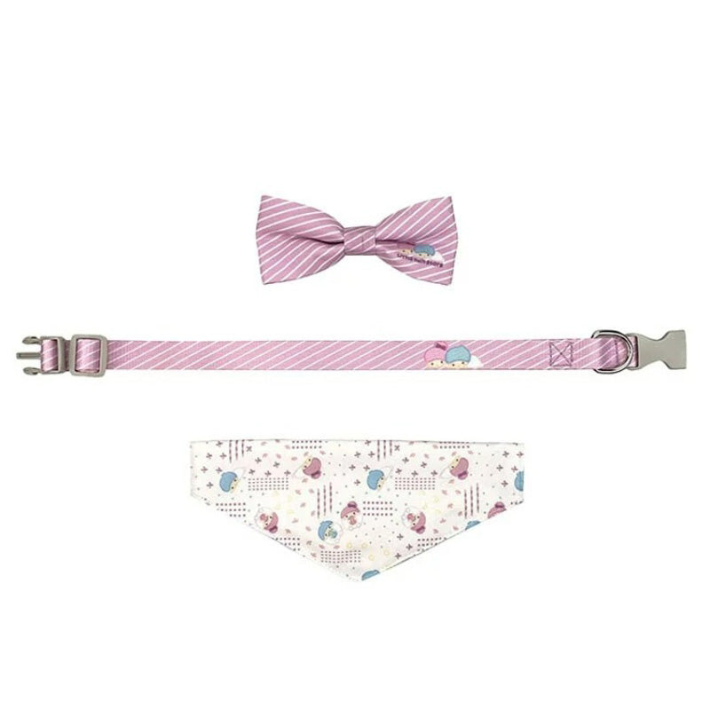 Close-up of pet collar set on small dog featuring bow and scarf in pastel colors.