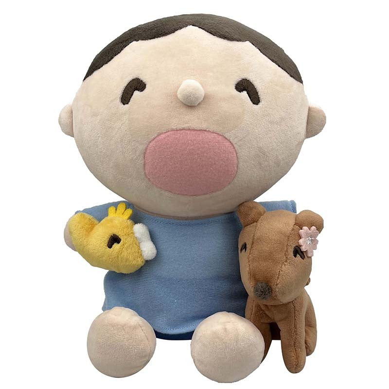 Tabo plush toy sitting upright, showcasing embroidered details.