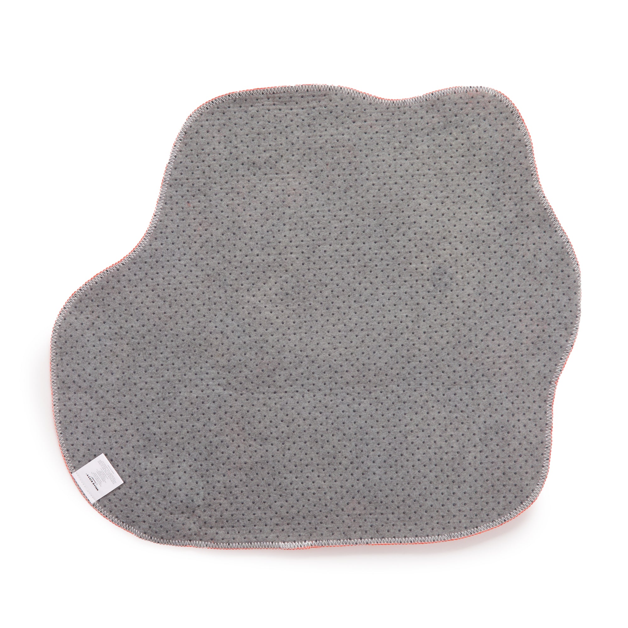Hello Kitty plush rug in a vibrant design, placed in a cozy living room setting.