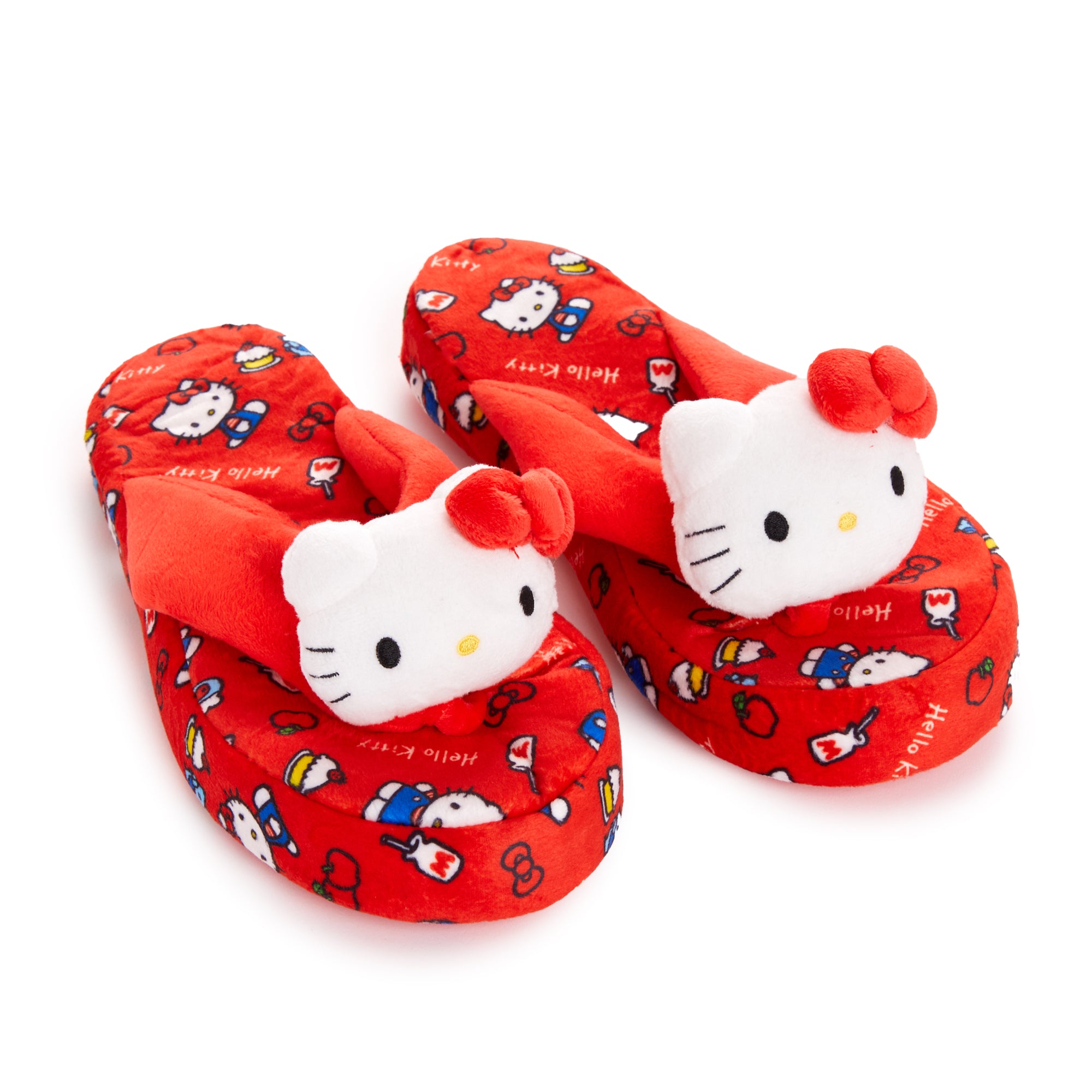 Front view of black Hello Kitty women's slippers on hardwood floor