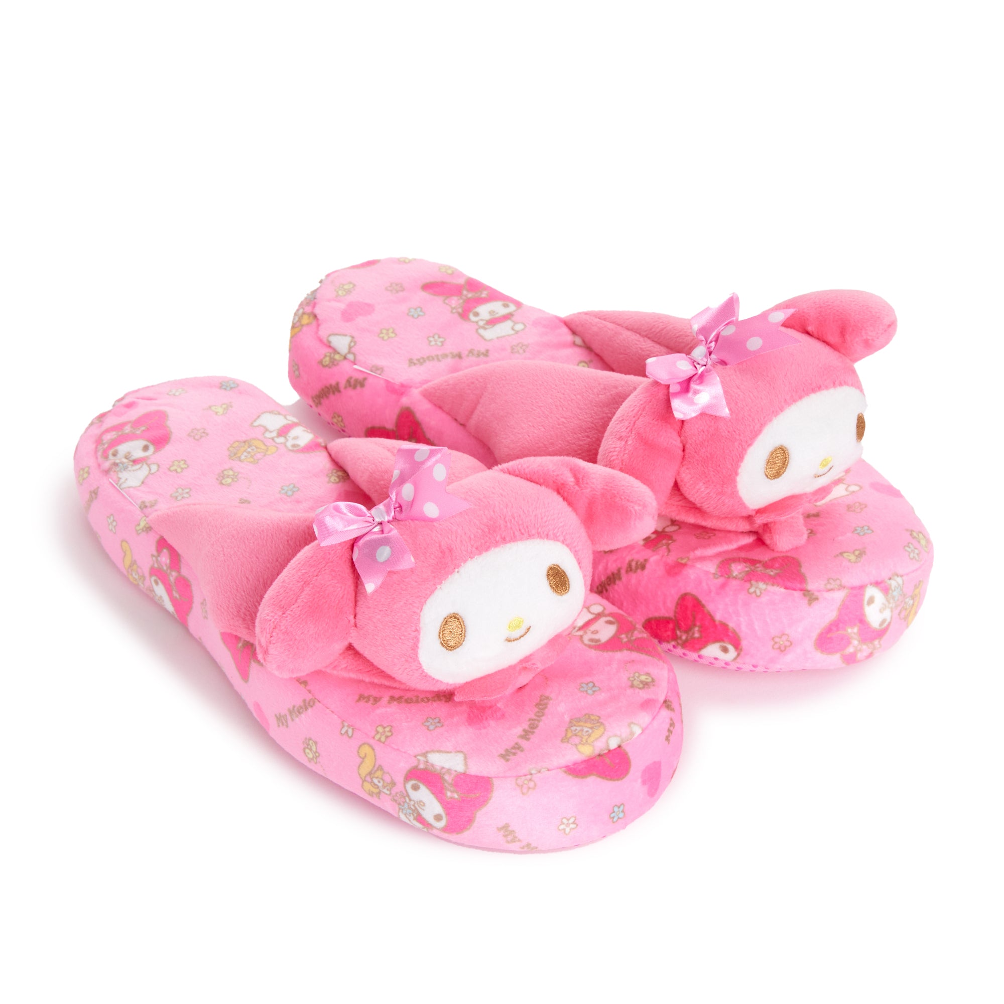 Cozy My Melody slippers with 3D character details on a soft surface.