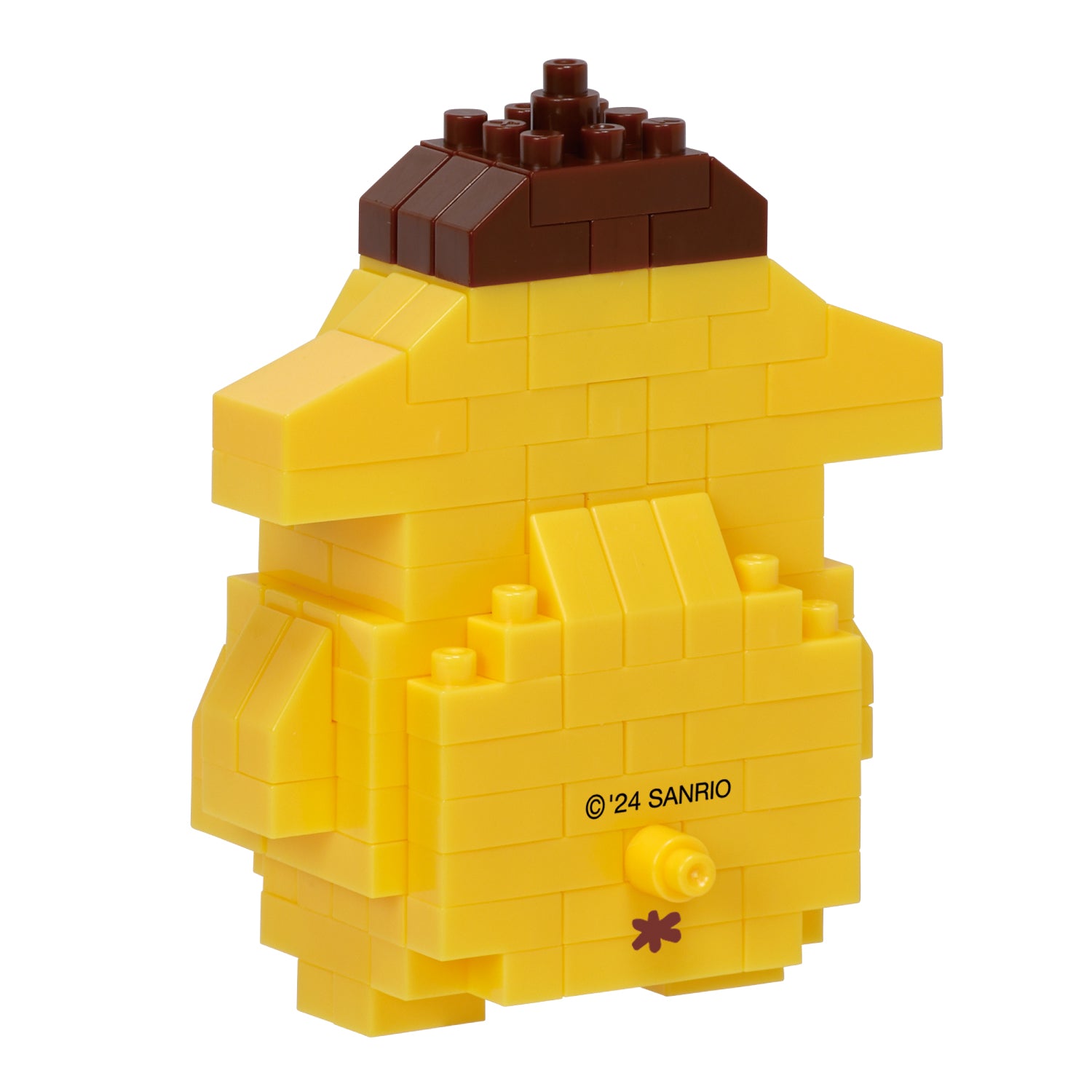 Side profile of the completed Pompompurin figurine posed near a newspaper—like the nyt mini crossword puzzle
