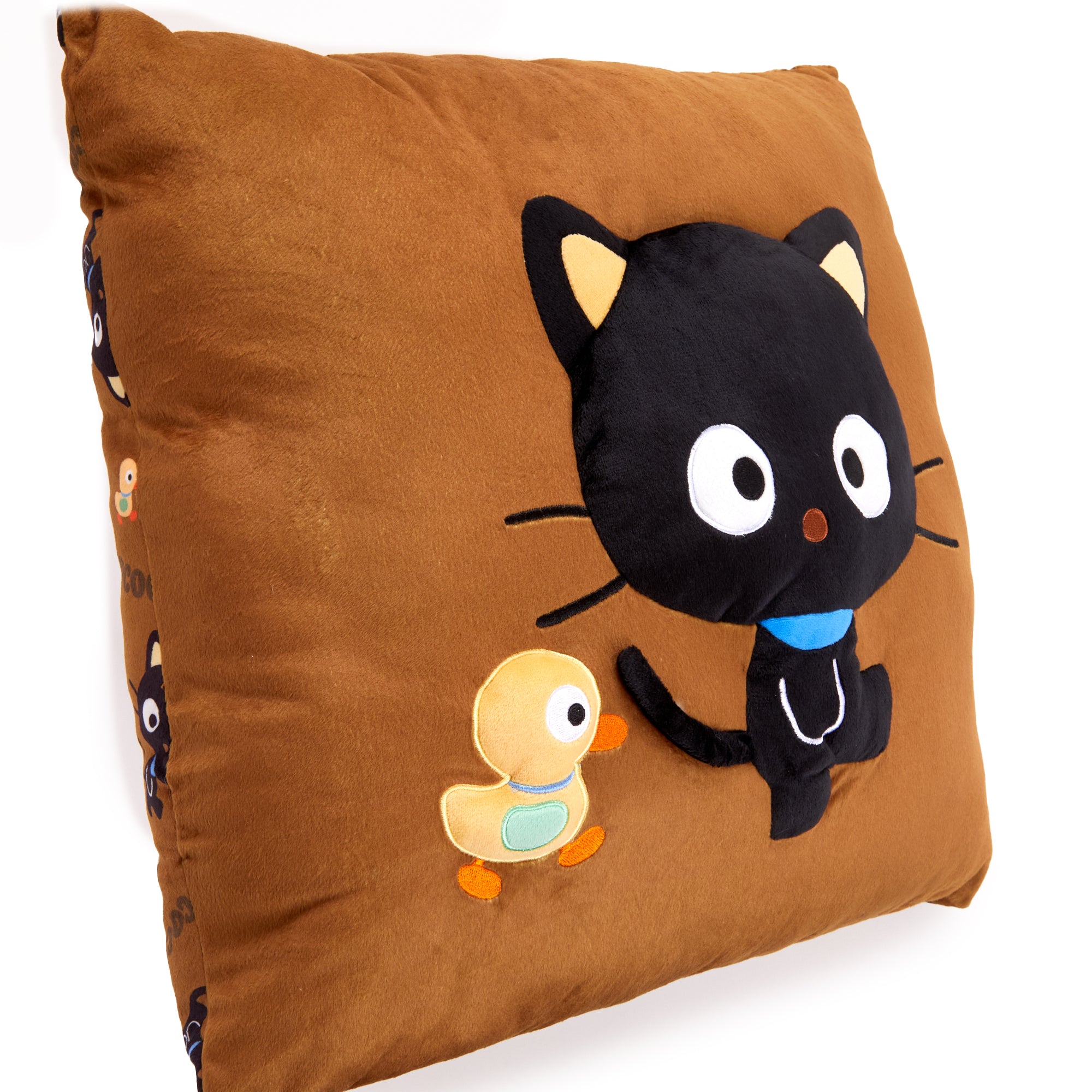 Chococat pillow styled with green throw pillows and Christmas throw pillows on a sofa