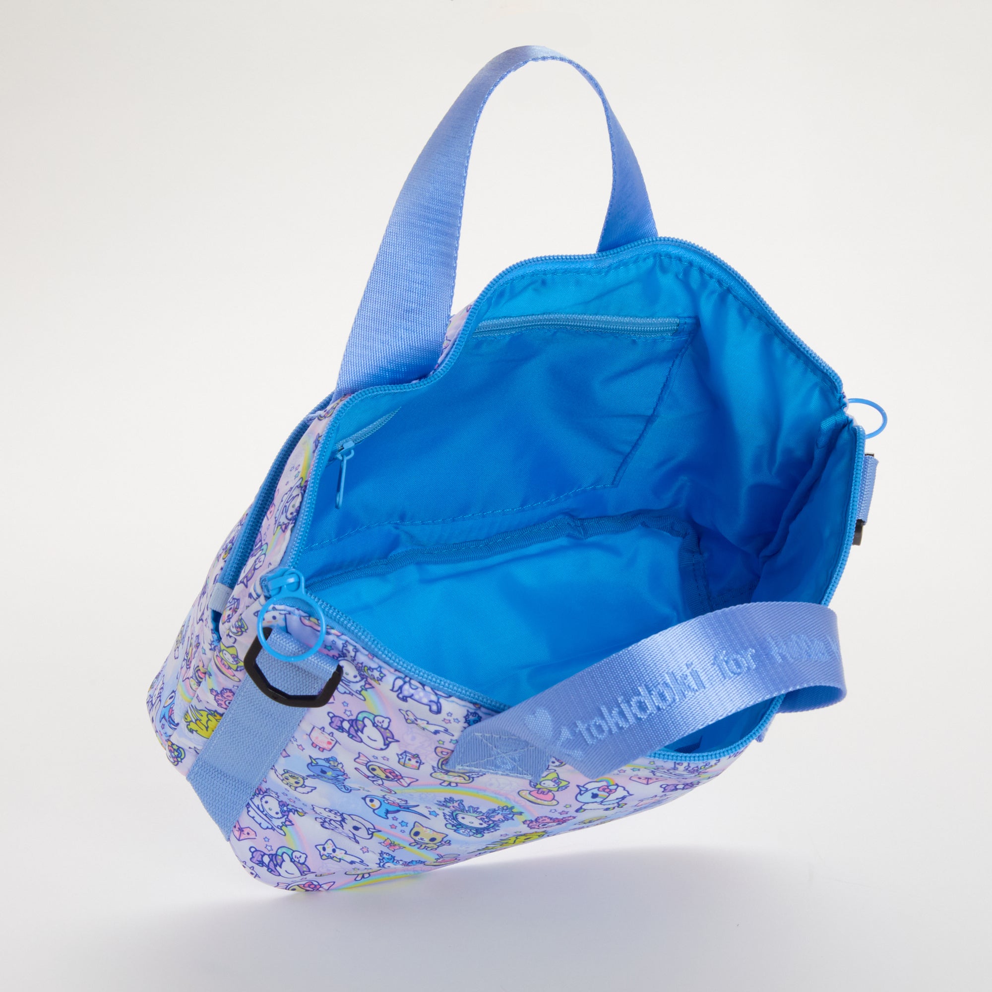 Inside view of the Hello Kitty tote bag with organized pockets for cosmetics and essentials.