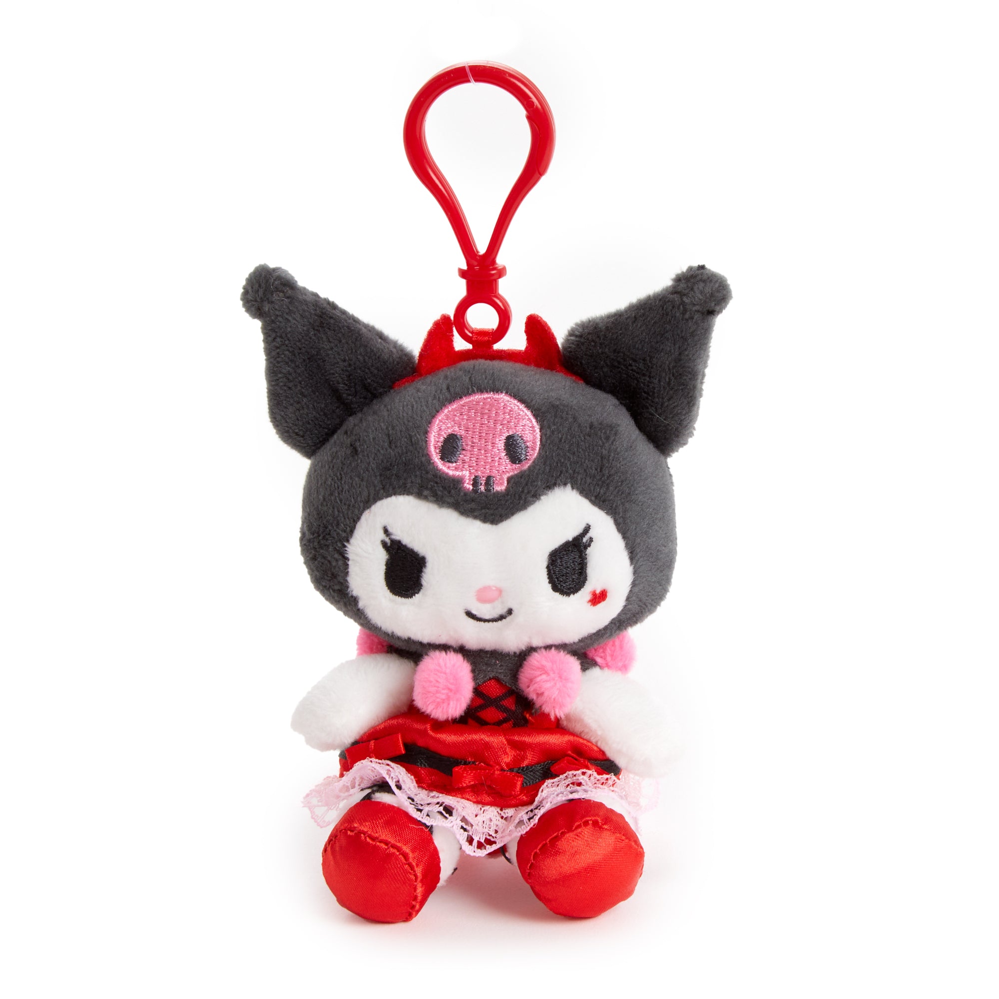 Kuromi plush clip attached to a denim backpack pocket