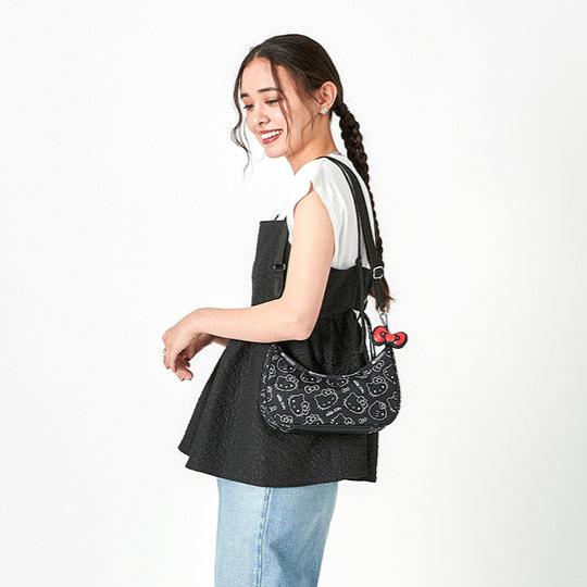 Front angle of Hello Kitty duffle bag showing zip closure and print placement