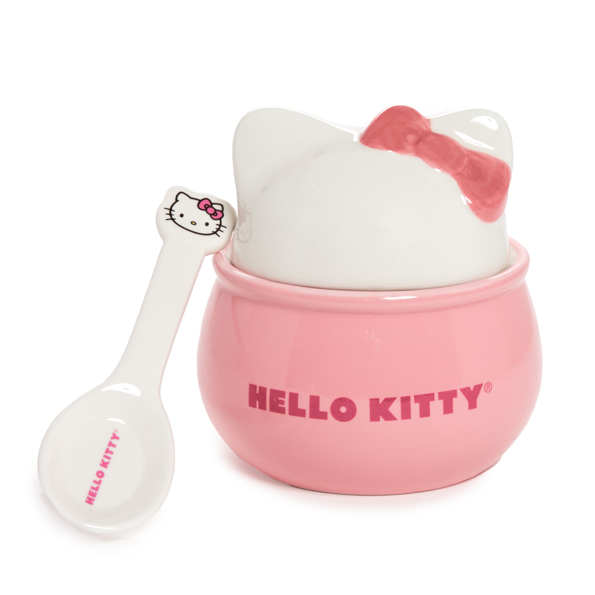 Pink Hello Kitty ceramic bowl with matching spoon on a white kitchen counter