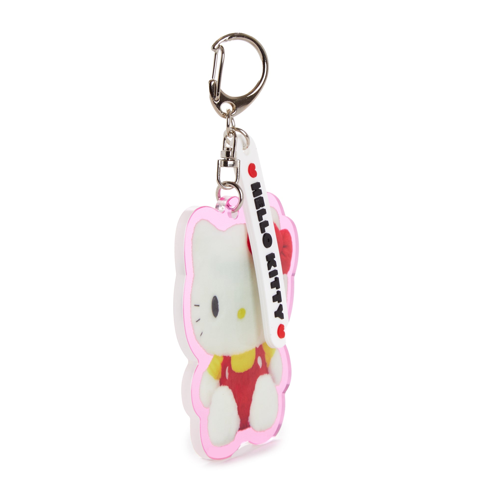 Hello Kitty acrylic keychain hanging from a denim bag strap