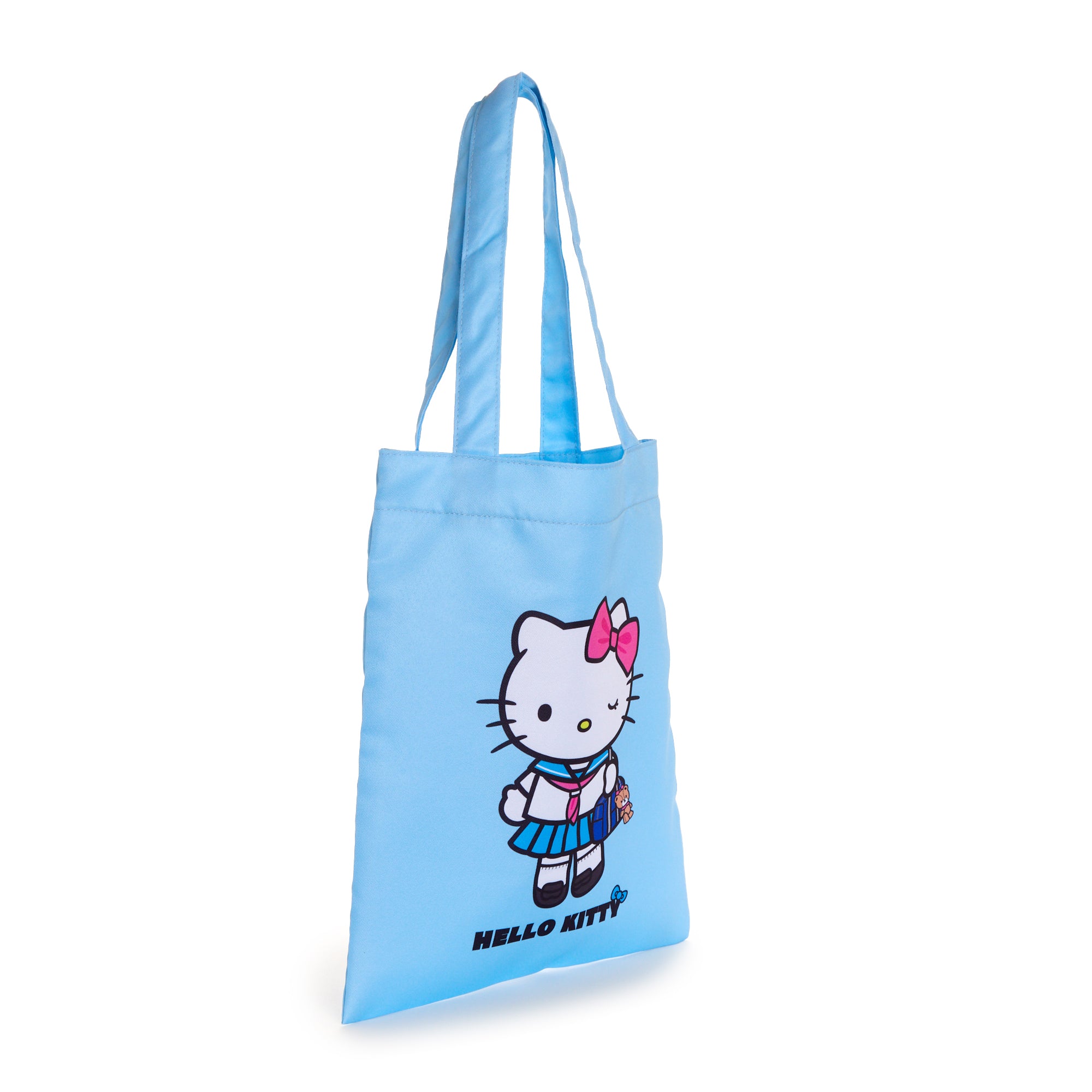 Hello Kitty sailor tote bag in use, carrying books and accessories