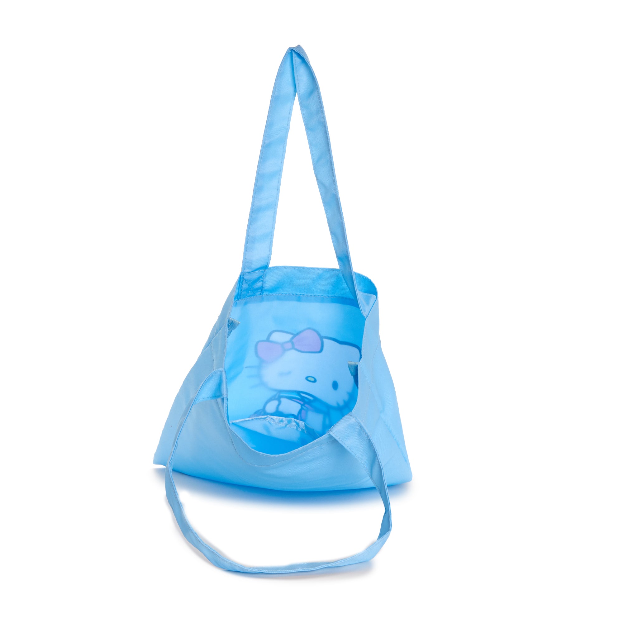 Hello Kitty sailor tote bag in use, carrying books and accessories