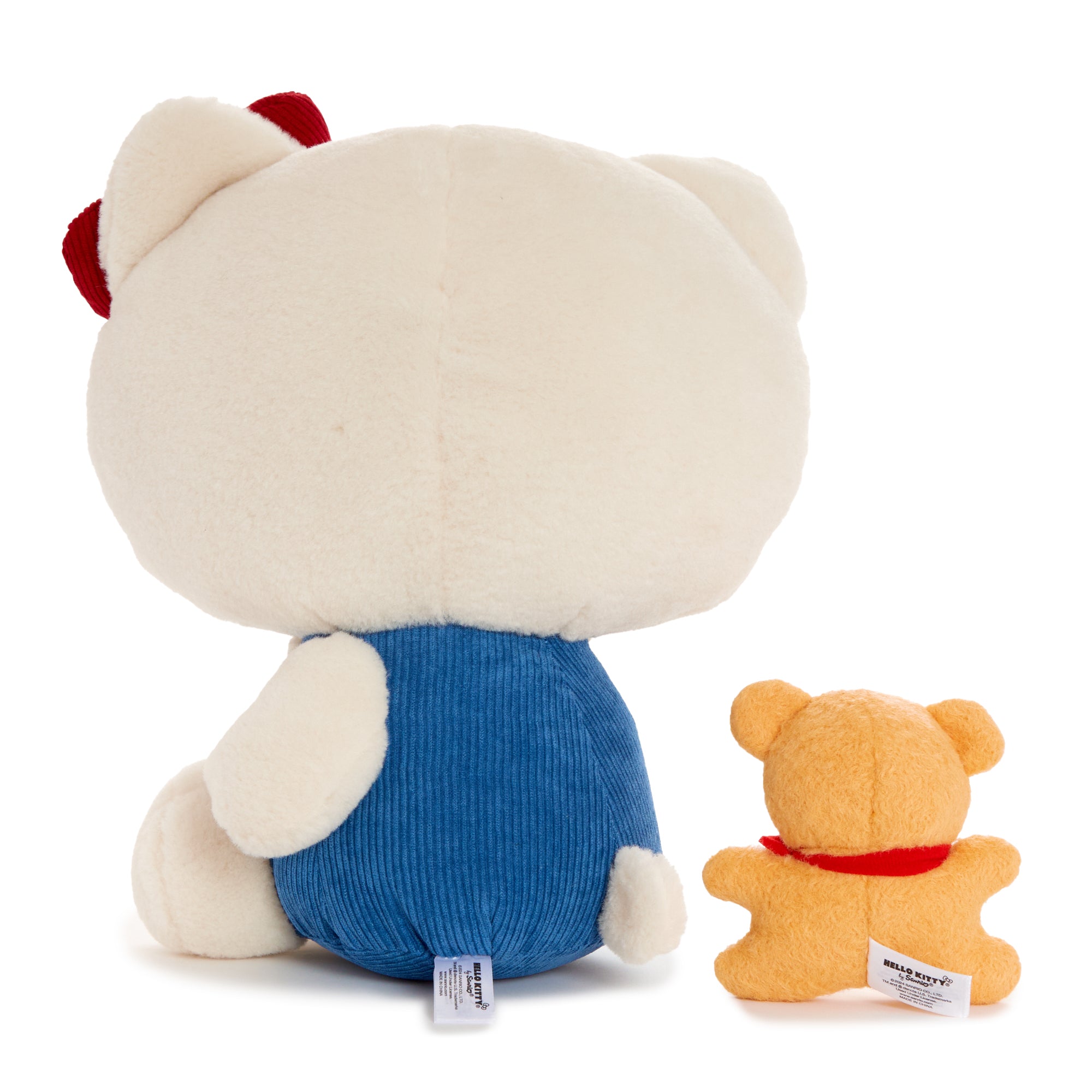 Backpack-ready Hello Kitty plush set in drawstring bag.