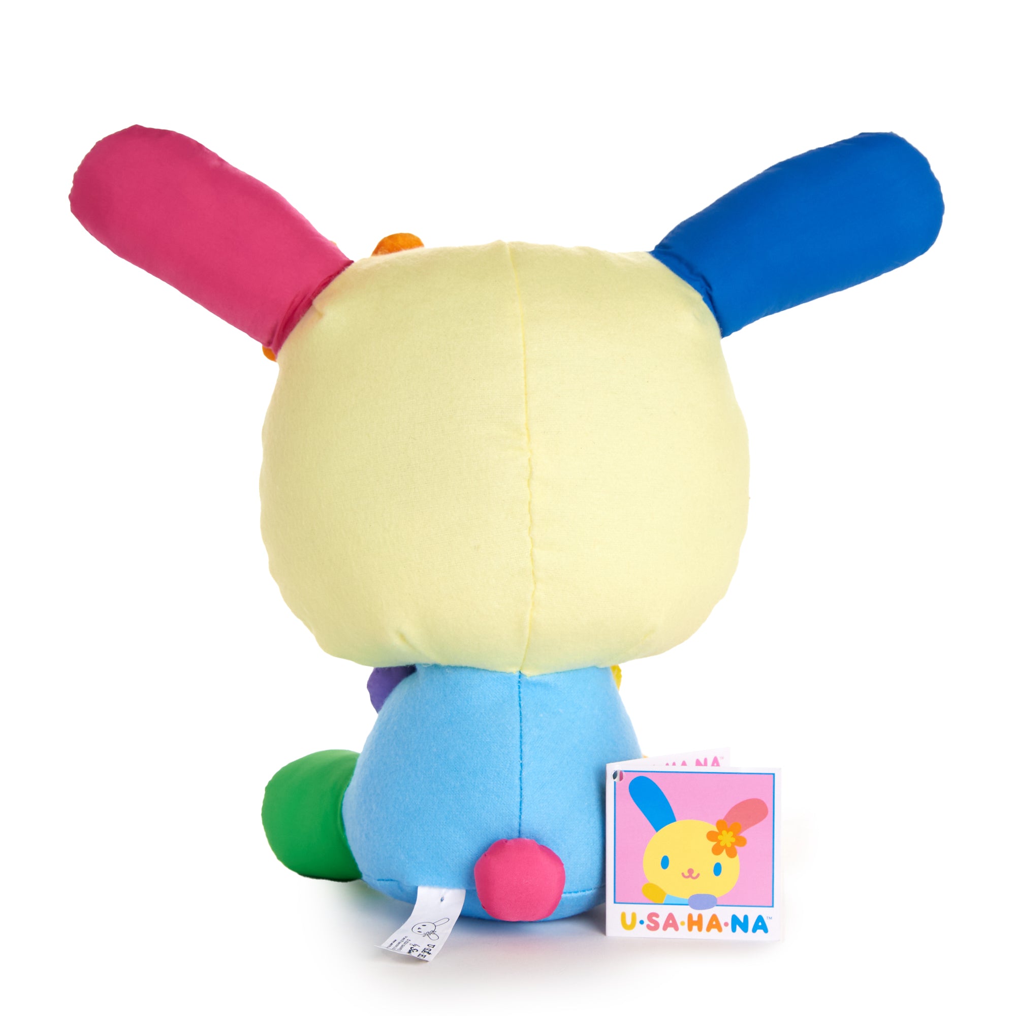 U*SA*HA*NA bunny plush toy beside summer-themed decor.