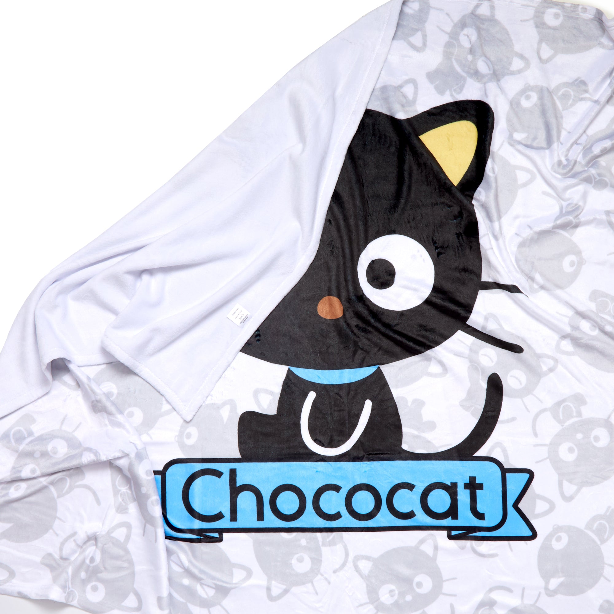 Close-up of the white reverse side of the Chococat blanket highlighting the quality material