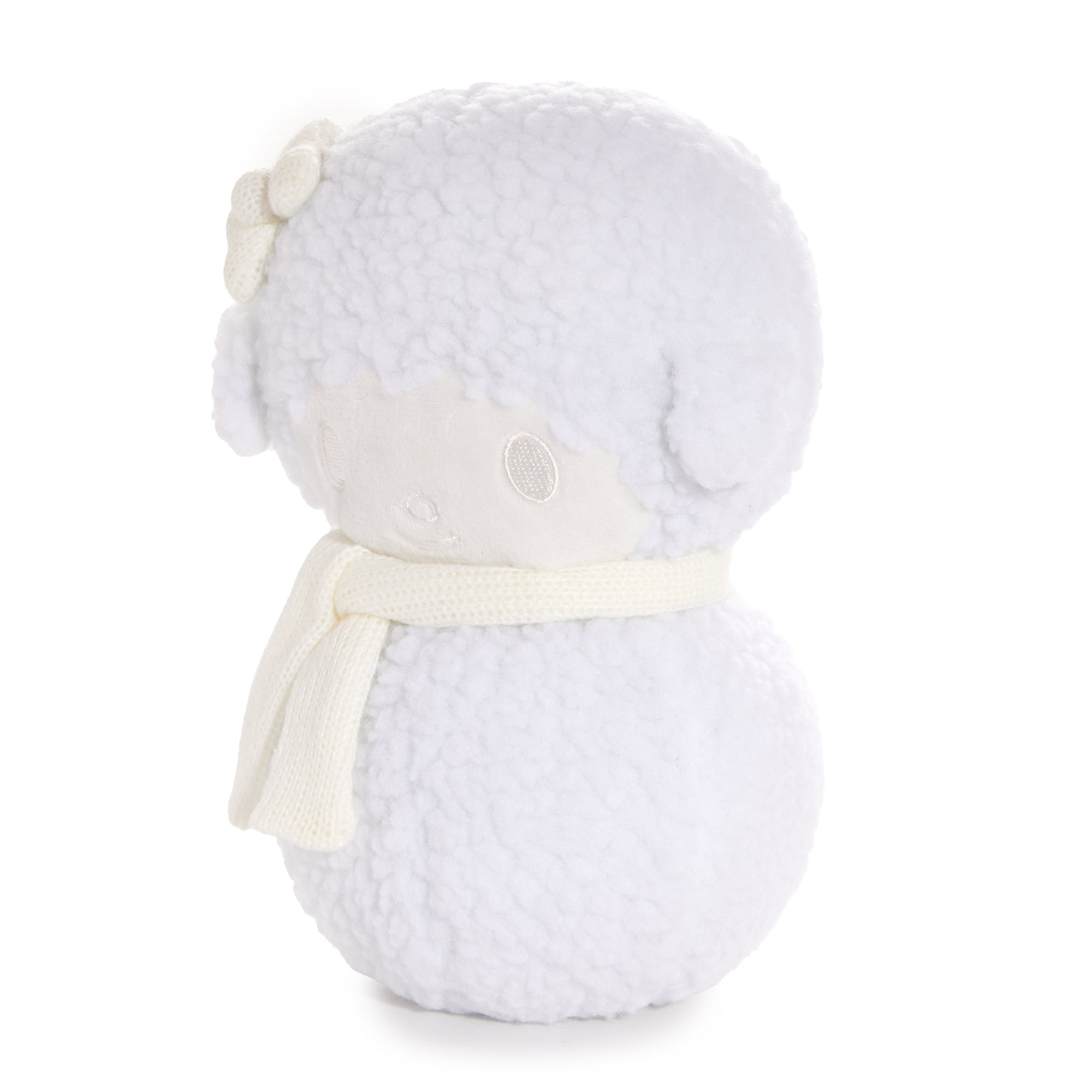 My Sweet Piano plush in a holiday setting, highlighting its boucle texture and scarf.