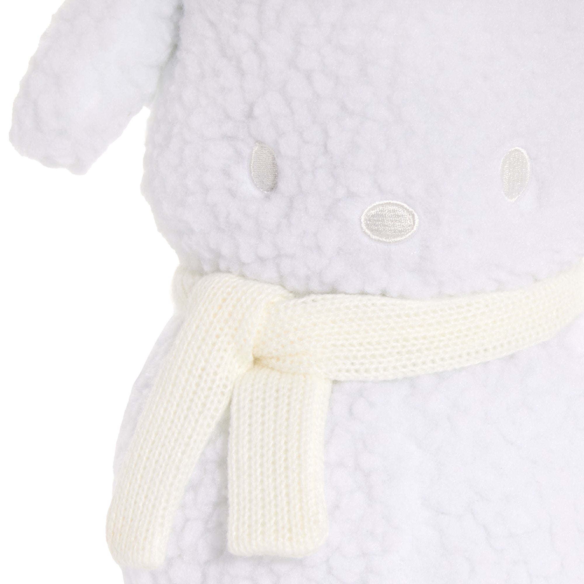Side profile of Pochacco plush, highlighting embroidered details.