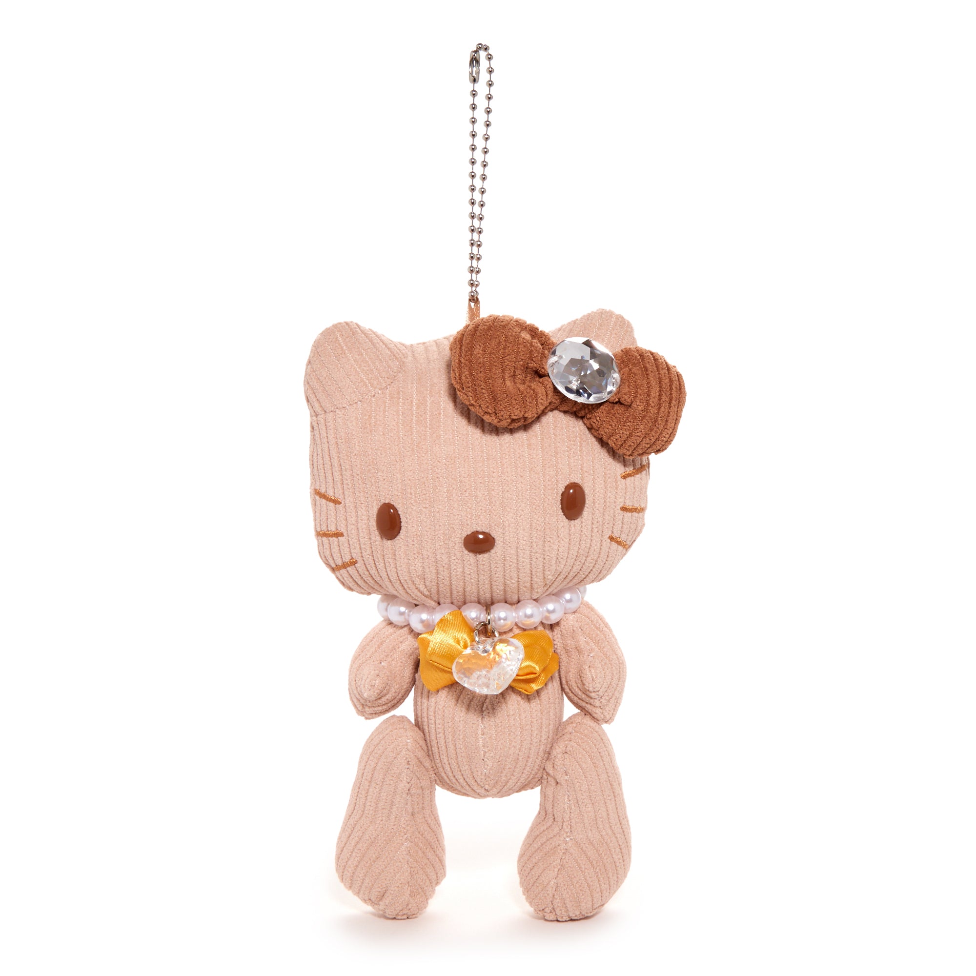 Close-up of Hello Kitty plush with jewels, showcasing embroidery.
