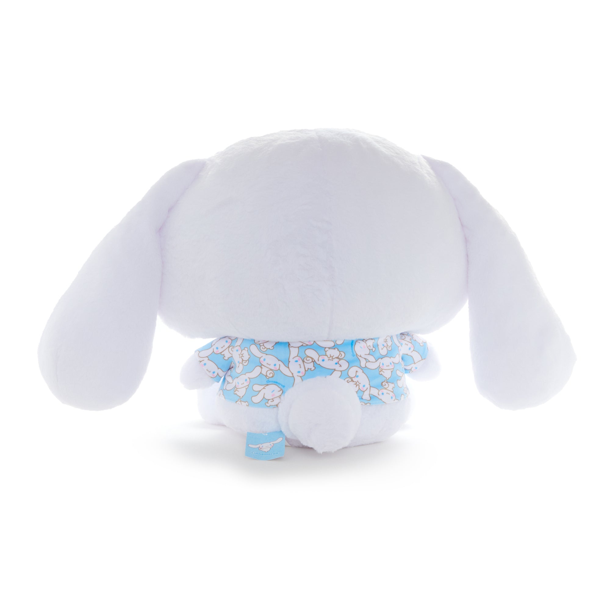 Oversized Sanrio mocha plush displayed on a cozy chair
