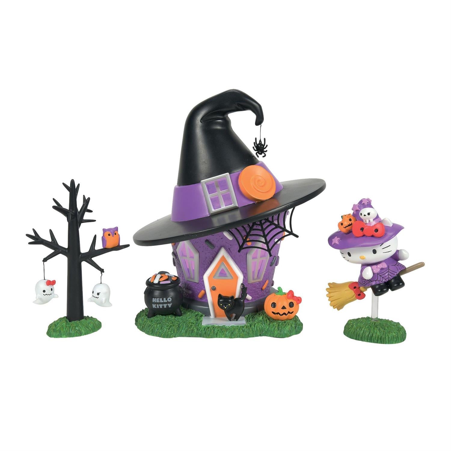 Hello Kitty Halloween Witch Tower figurine set displayed on a shelf, with a mini-cauldron and lighted building