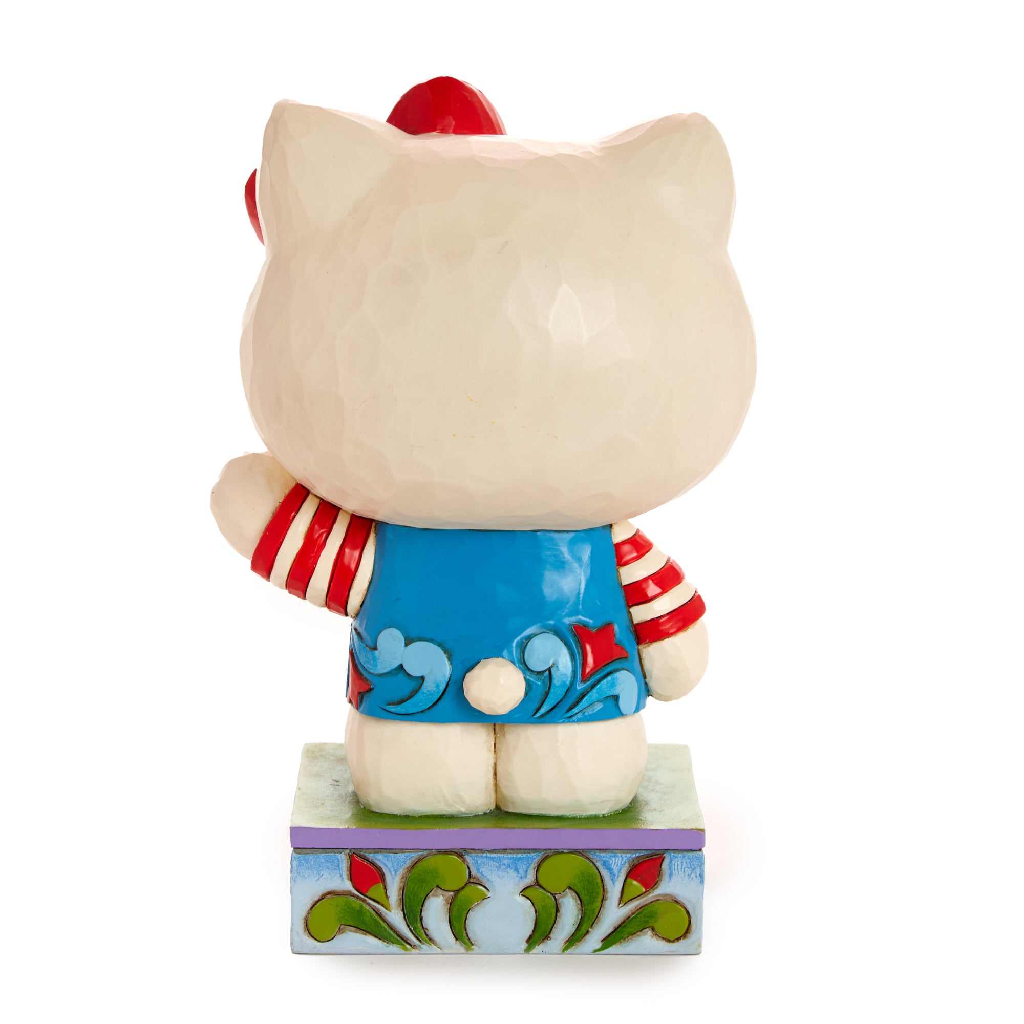 Front view of Hello Kitty crystal figurine in Jim Shore rosemale overalls – ideal Sanrio figurines gift