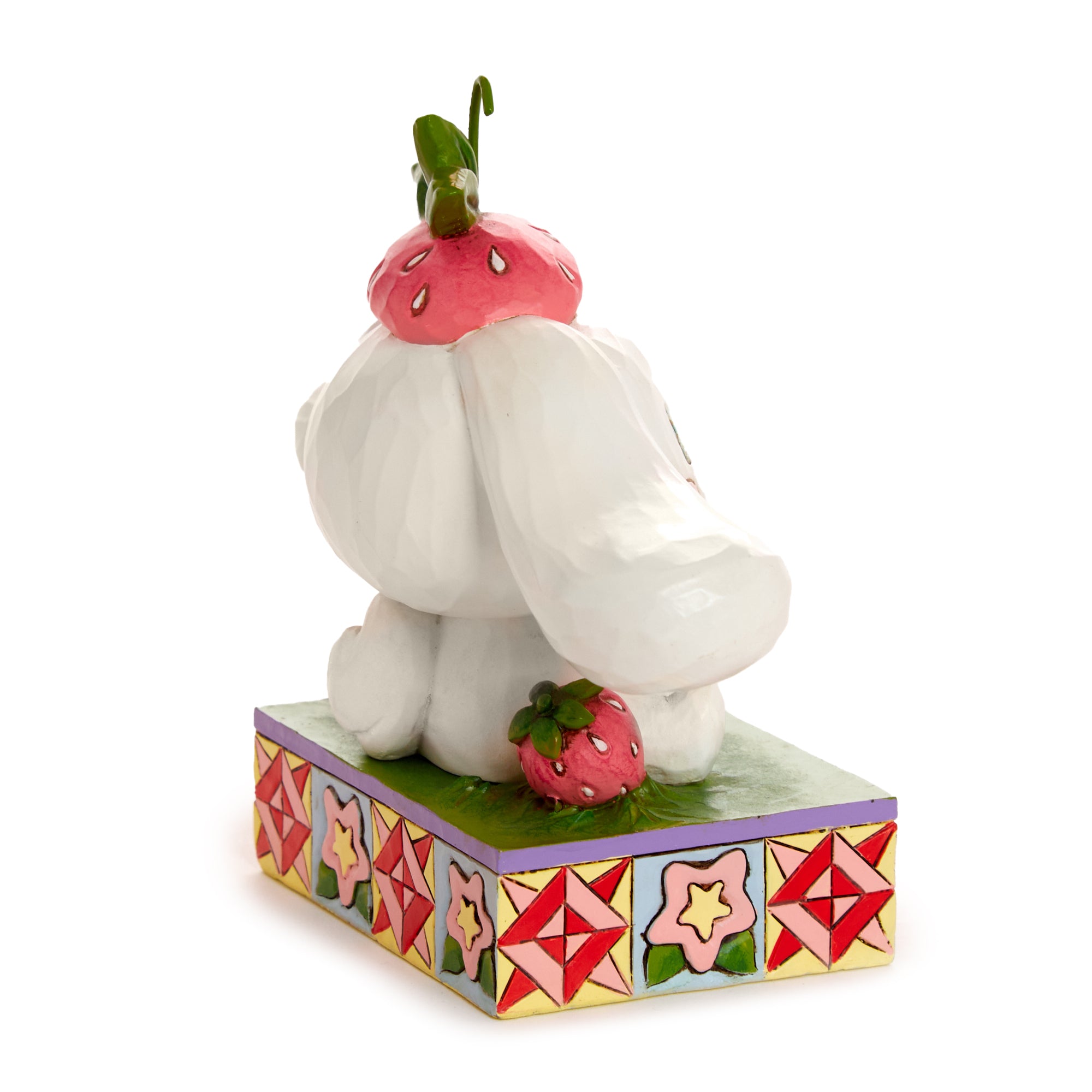 Cinnamoroll figurine with strawberries, colorful design by Jim Shore.