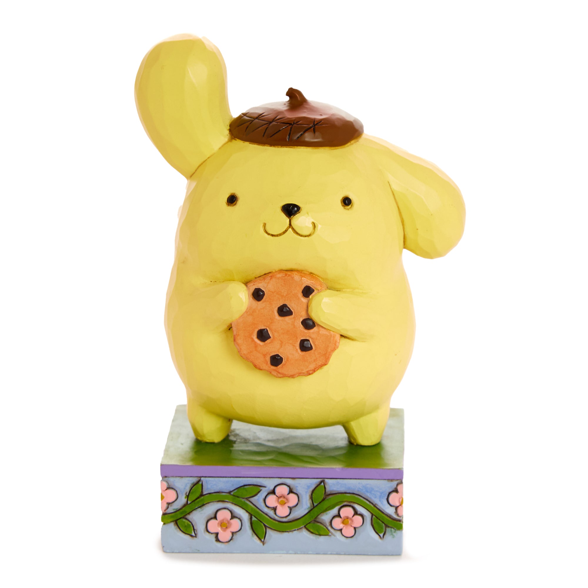 Close-up of Jim Shore’s Pompompurin figurine showing intricate cookie and beret details