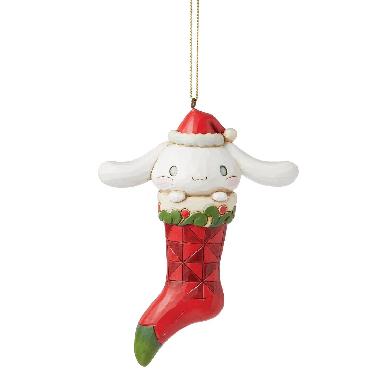 Cinnamoroll ornament hanging on a Christmas tree, showcasing festive colors.