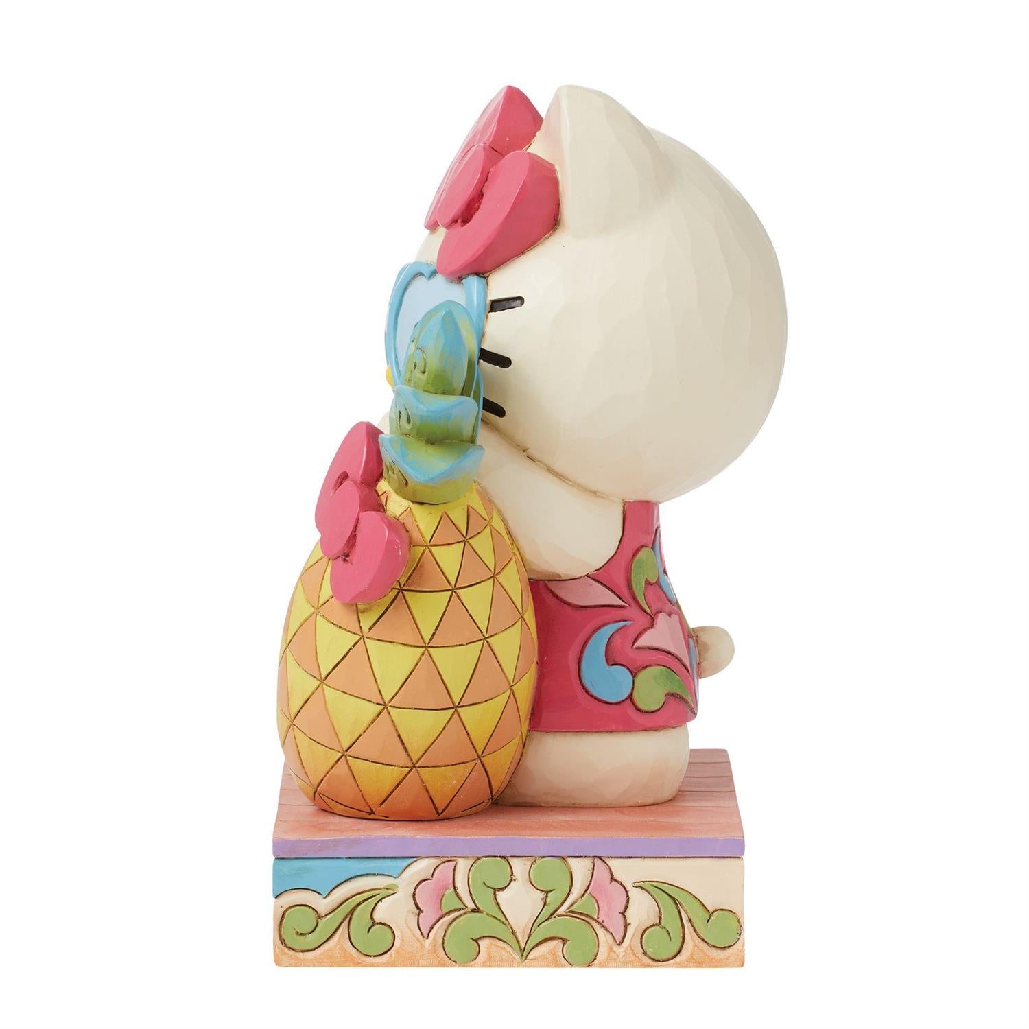 Side angle of Hello Kitty summer figurine with heart sunglasses