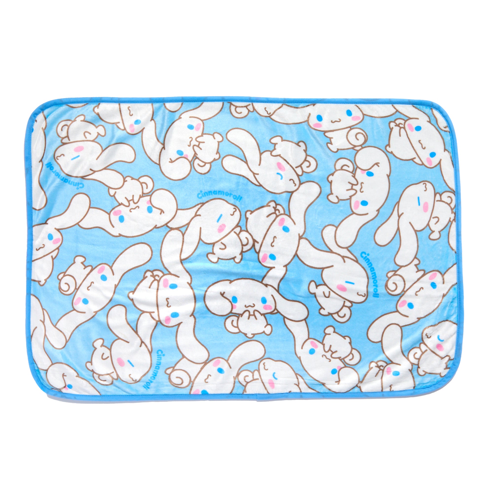 Cinnamoroll throw blanket draped over a cozy couch, featuring an all-over print design with Sanrio characters.