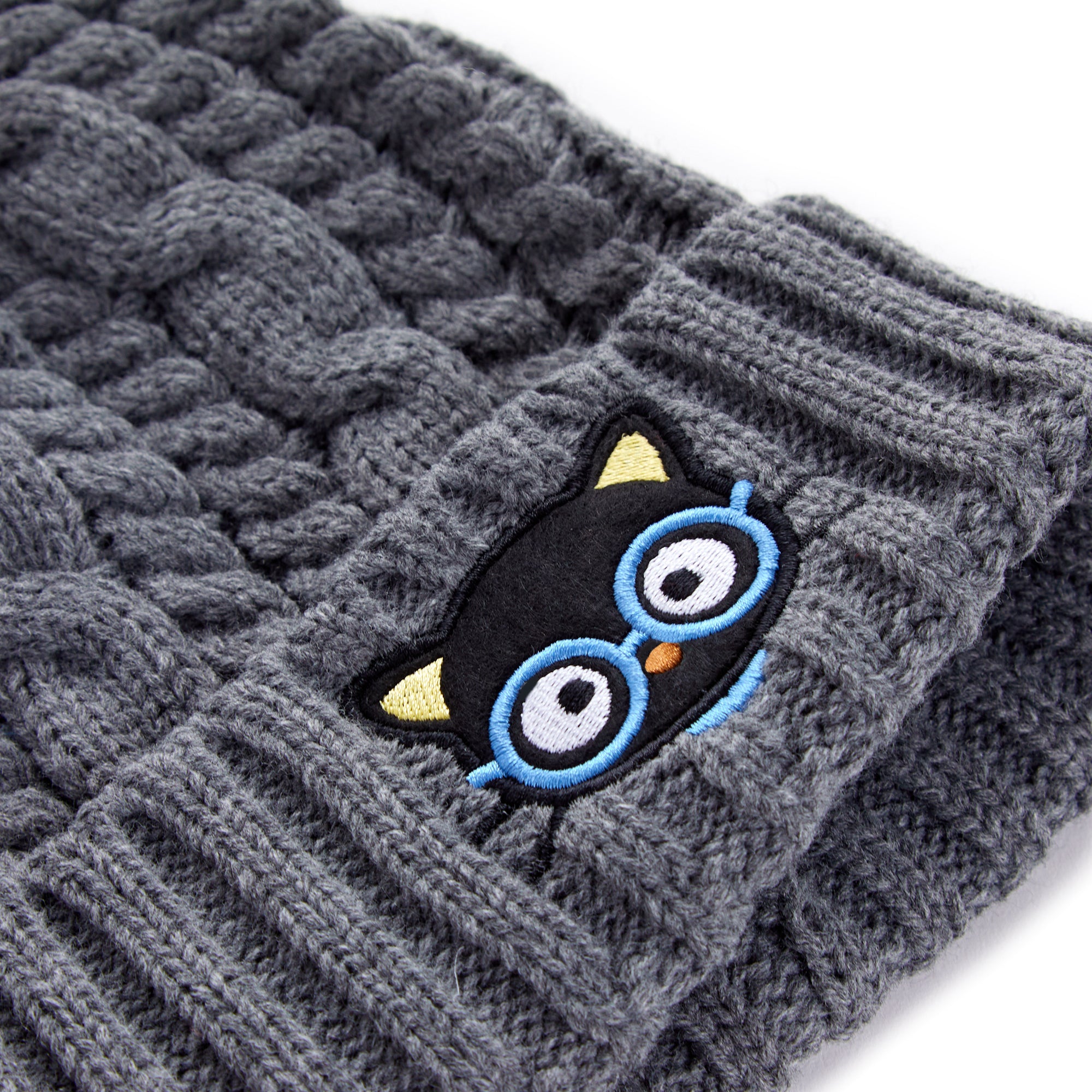 Close-up of Chococats face embroidered on winter hat