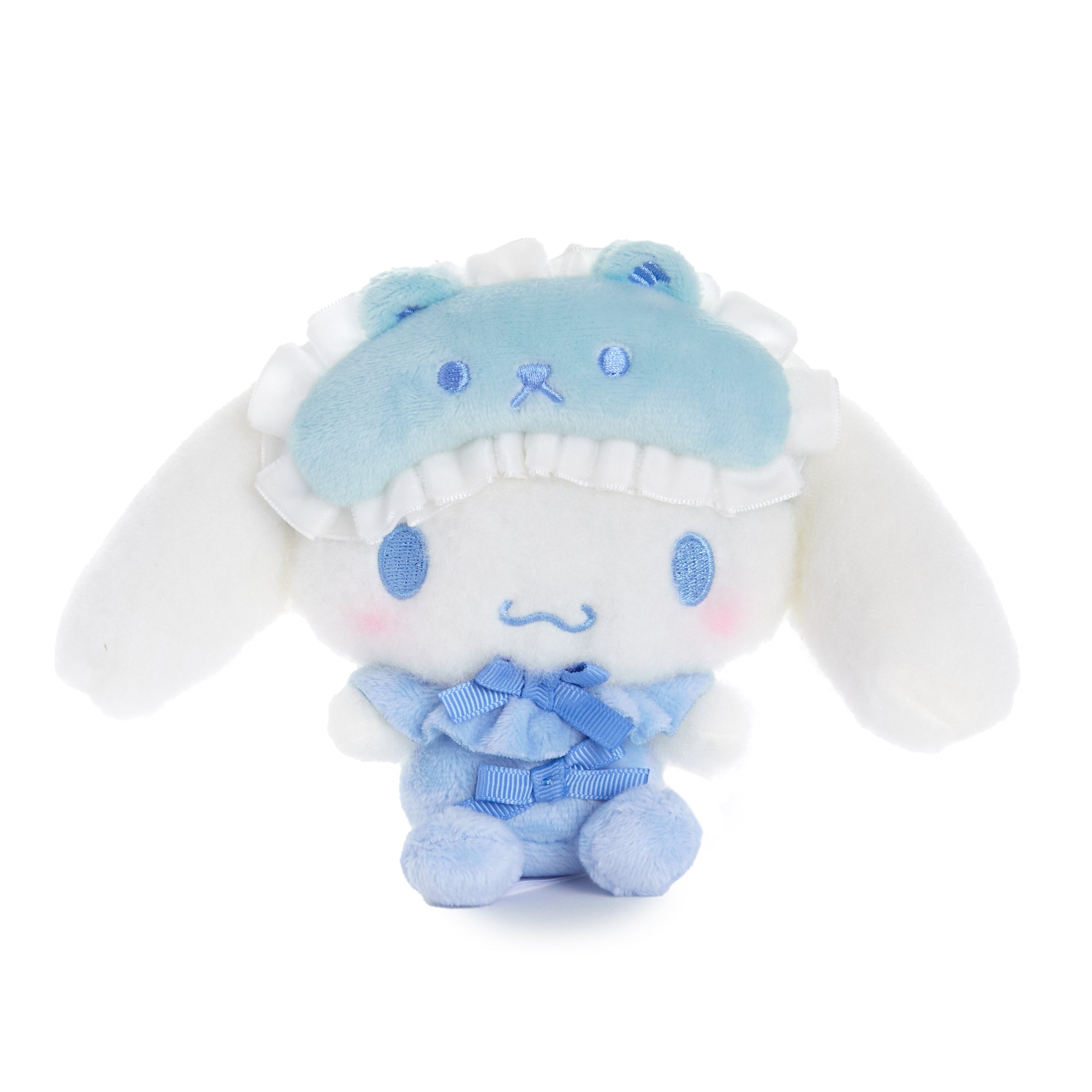 Close-up of fluffy Cinnamoroll plush showcasing embroidered details.