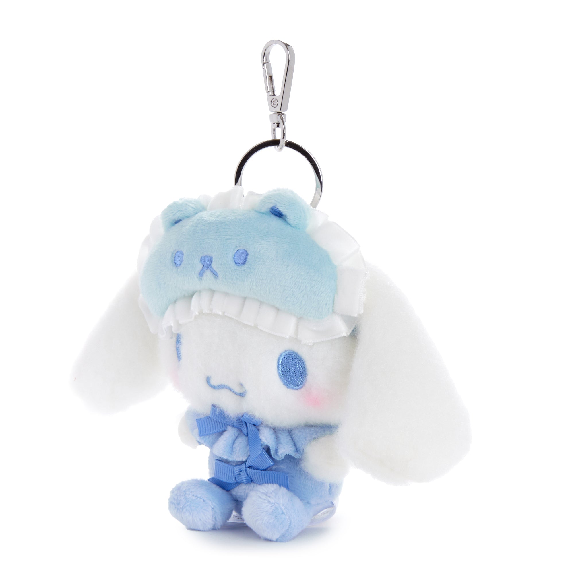 Cinnamoroll plush big toy in a cozy bedroom setting.