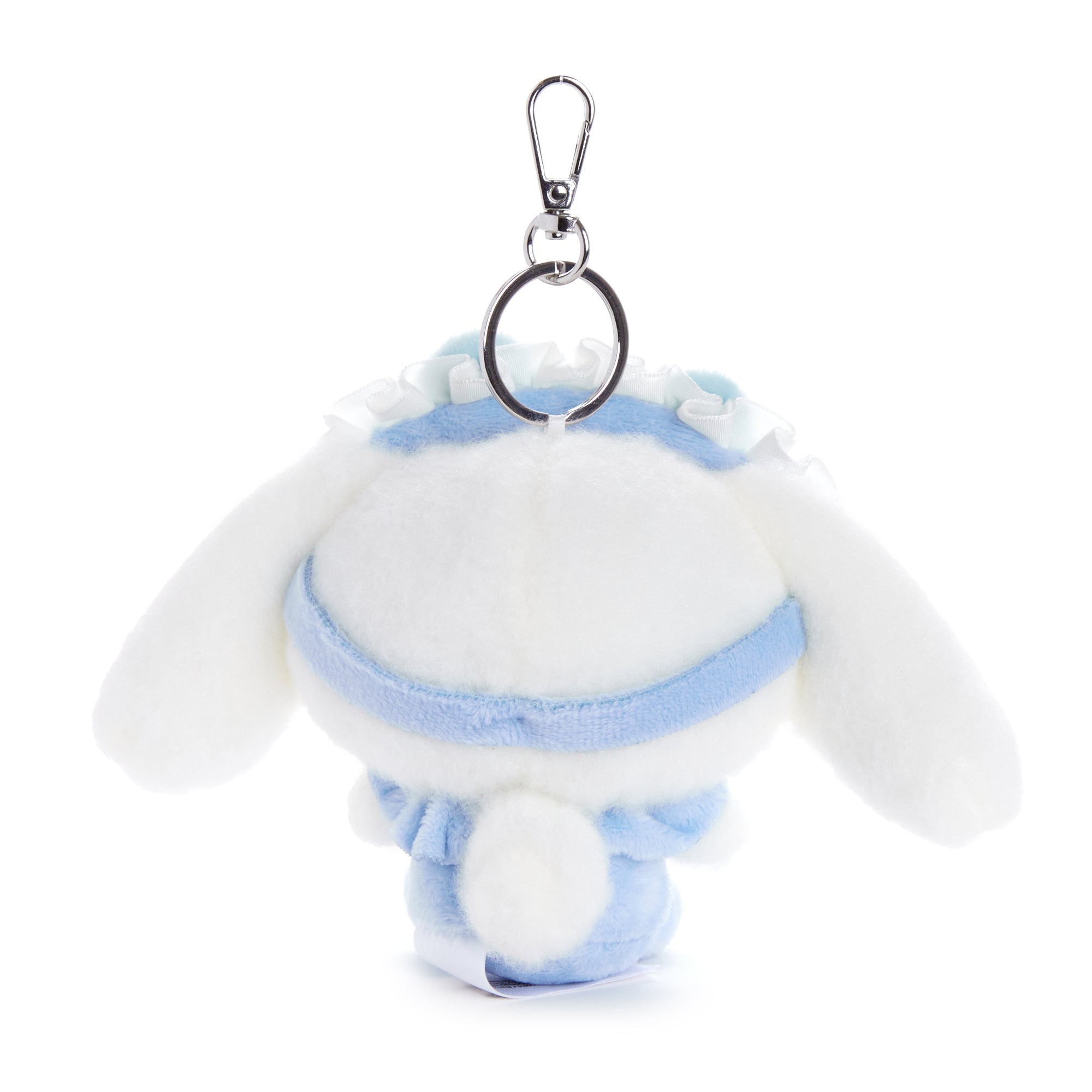 Close-up of fluffy Cinnamoroll plush showcasing embroidered details.