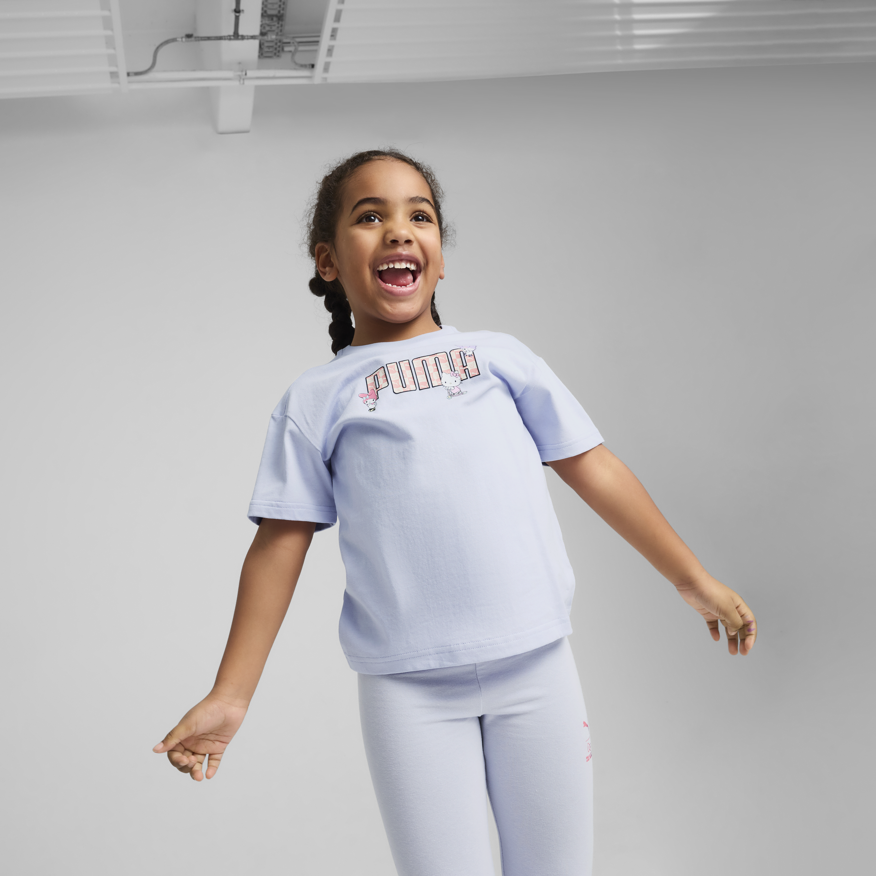 Close-up of Hello Kitty and Friends artwork on PUMA kids tee