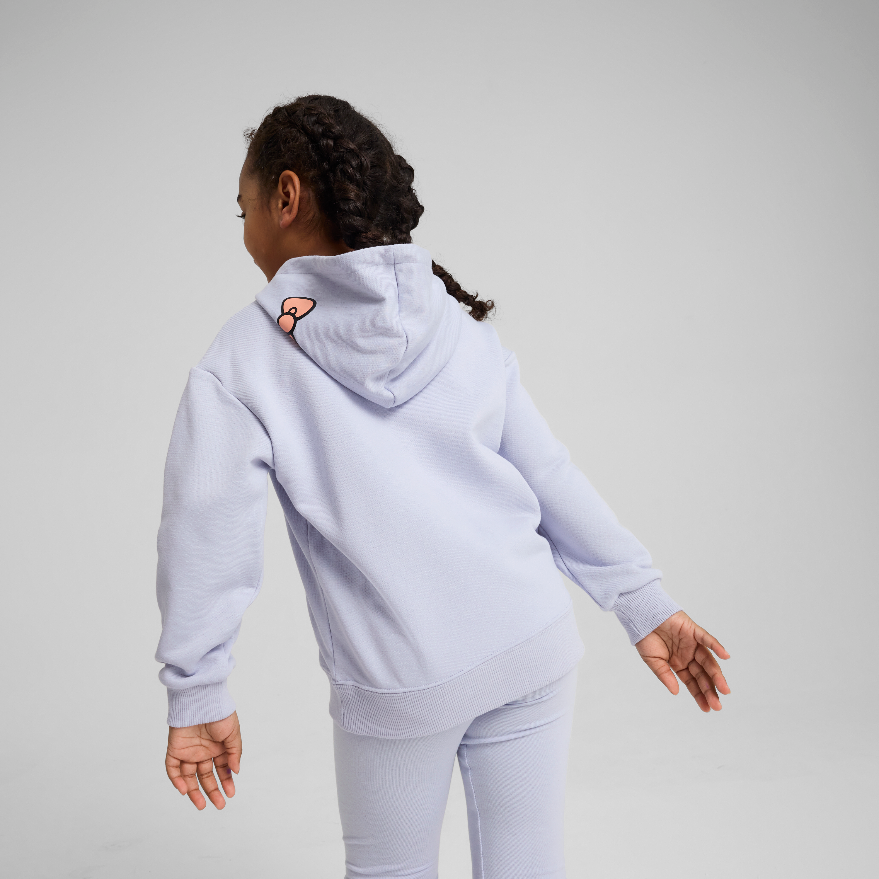 Close-up of the colorful PUMA co-branded gradient print on the hoodie