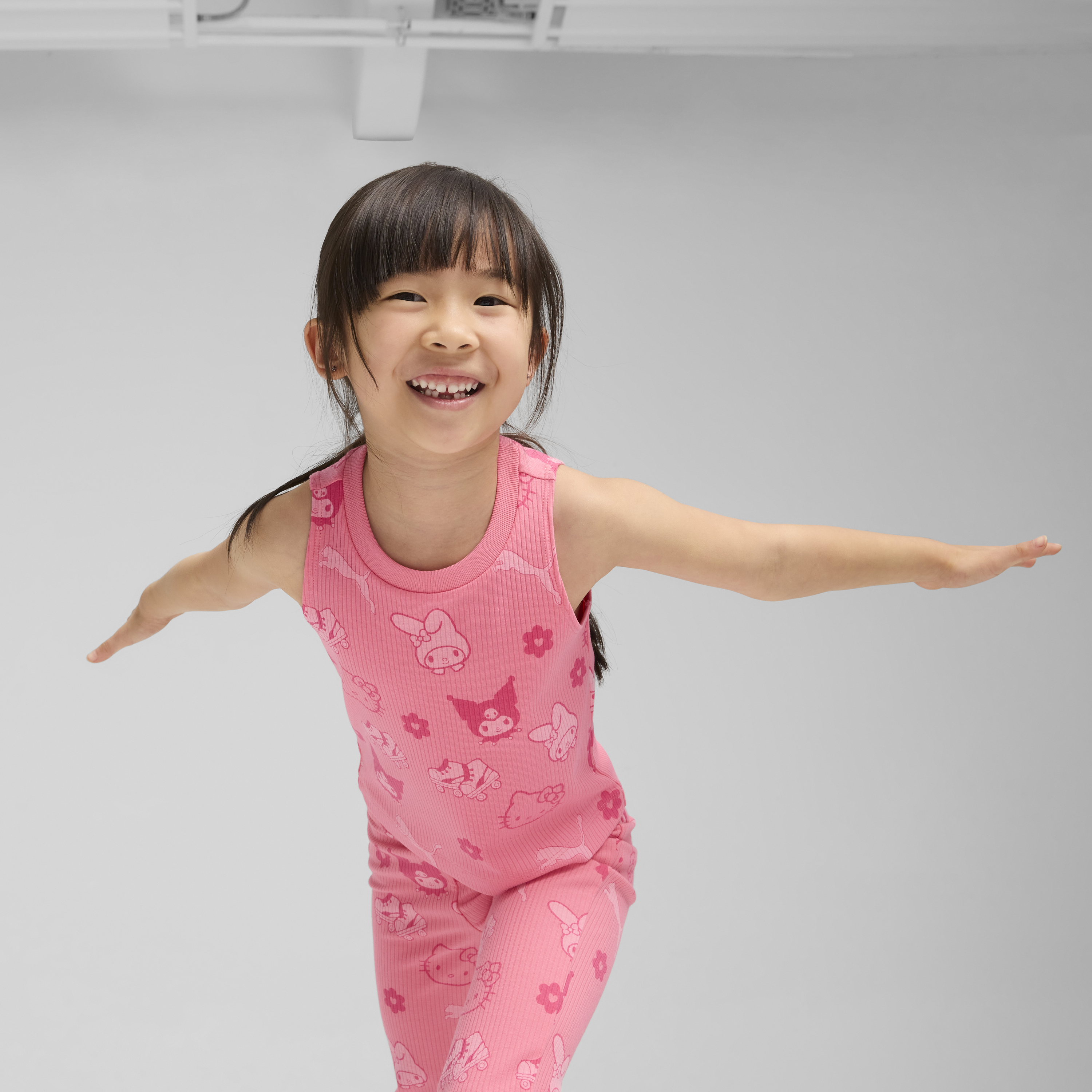 Front view of Hello Kitty and PUMA kids tank top in Magic Rose.