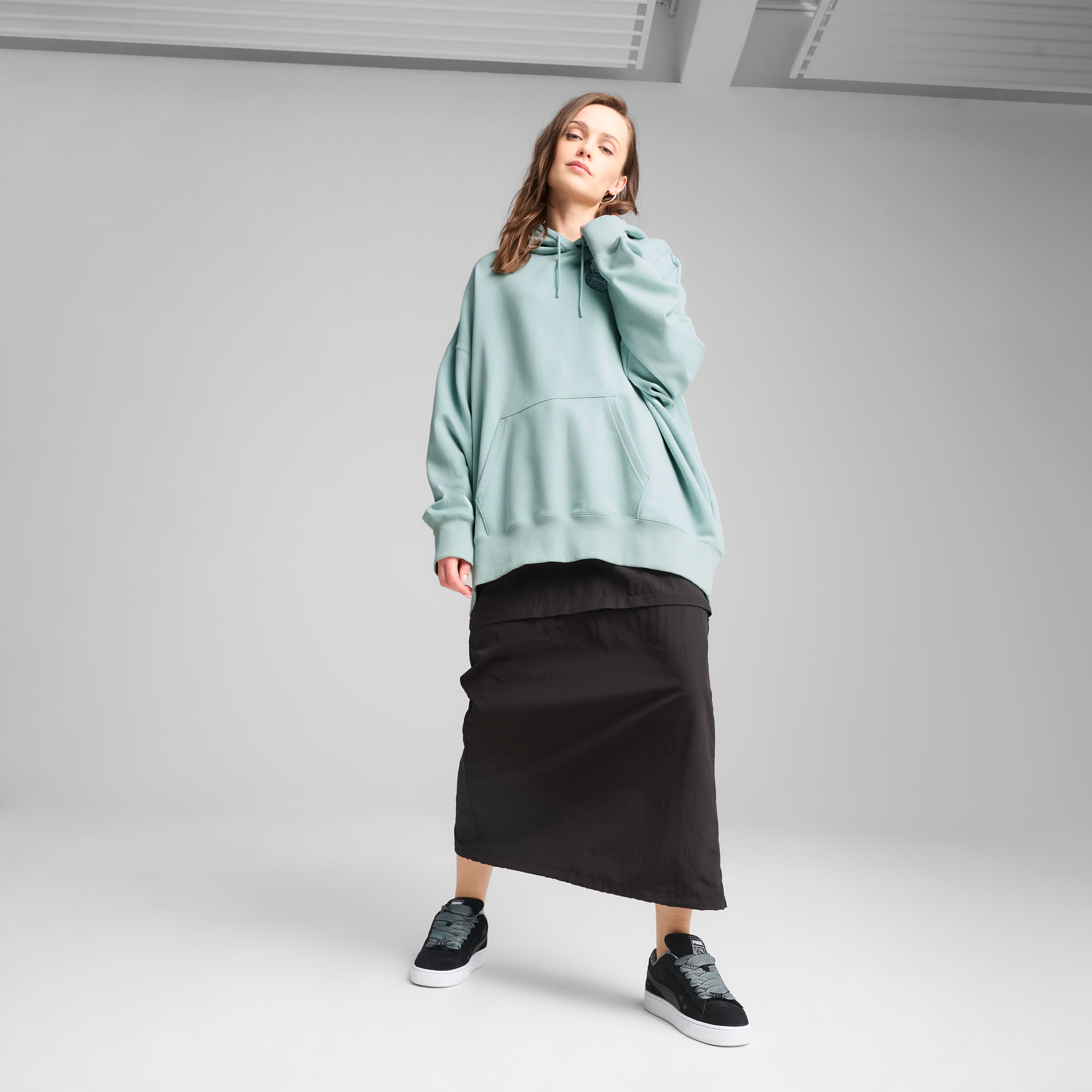 Side view highlighting the relaxed fit and French terry material.