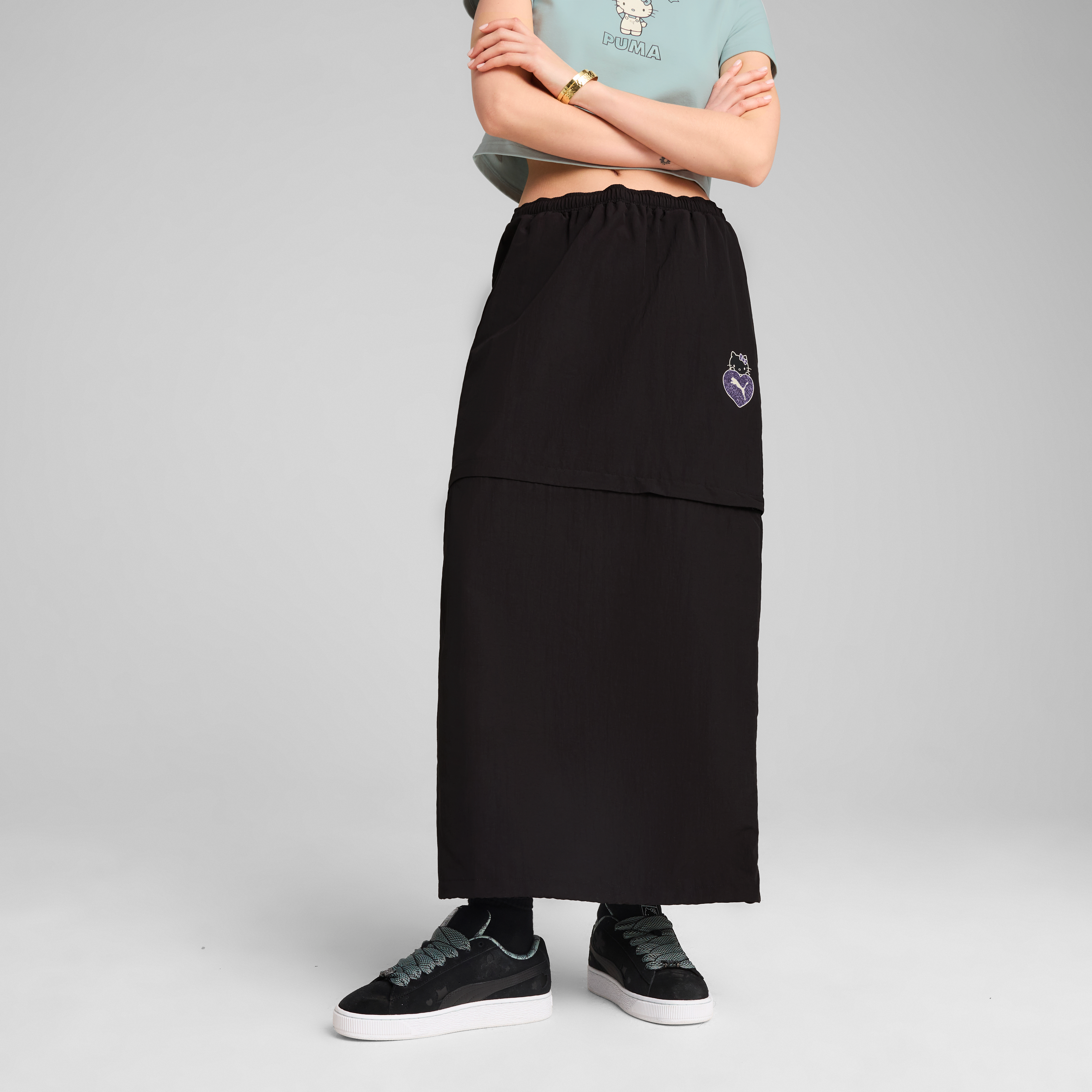 Black Hello Kitty skirt showcasing its stylish back slit and elastic waistband.
