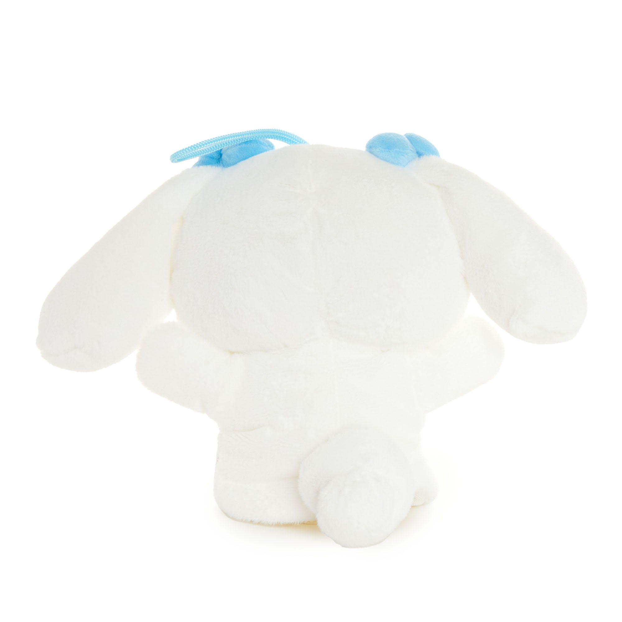 Cinnamoroll plush hand puppet with embroidered details in a childs hands