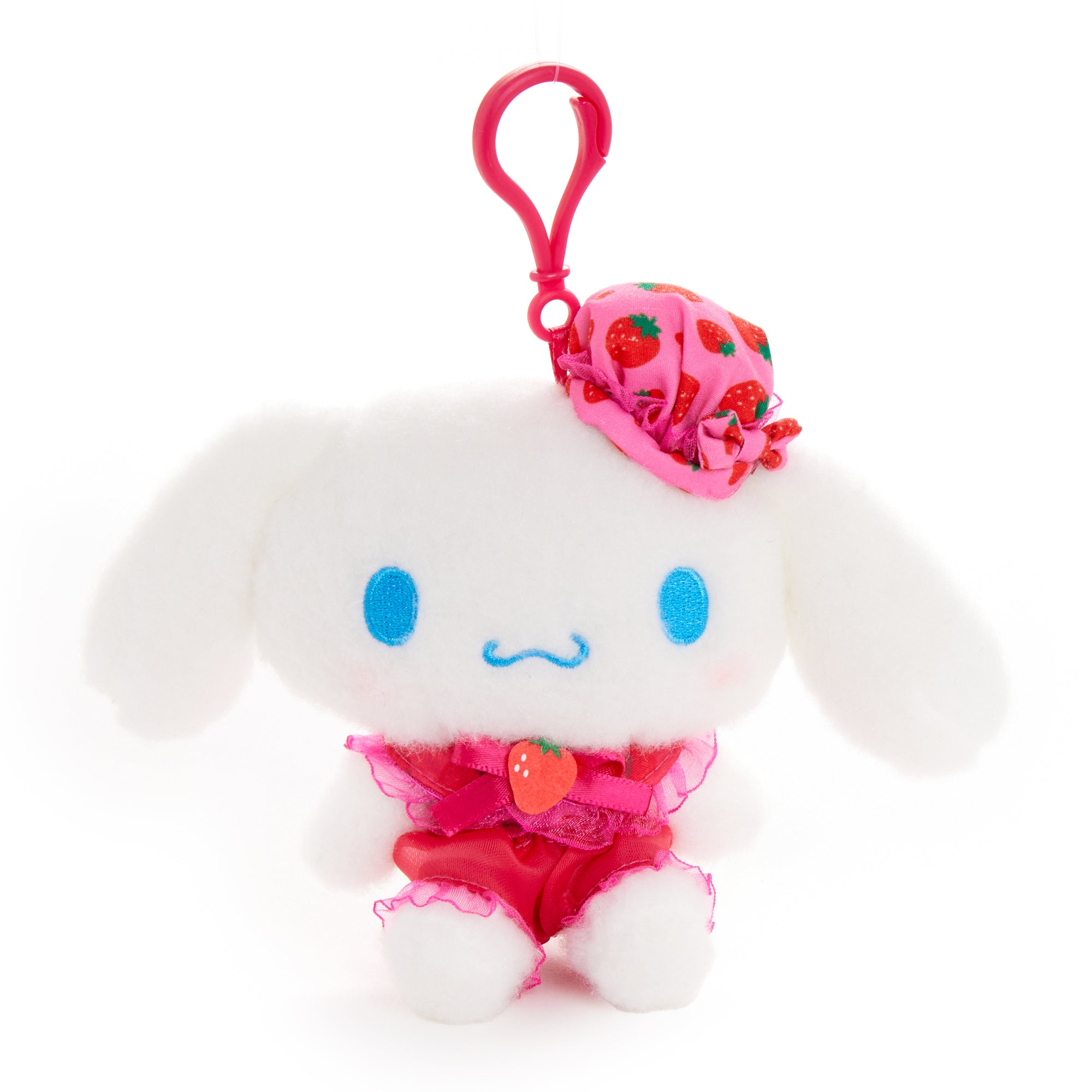 Front view of Cinnamoroll plush clip with strawberry-themed outfit and lace bow