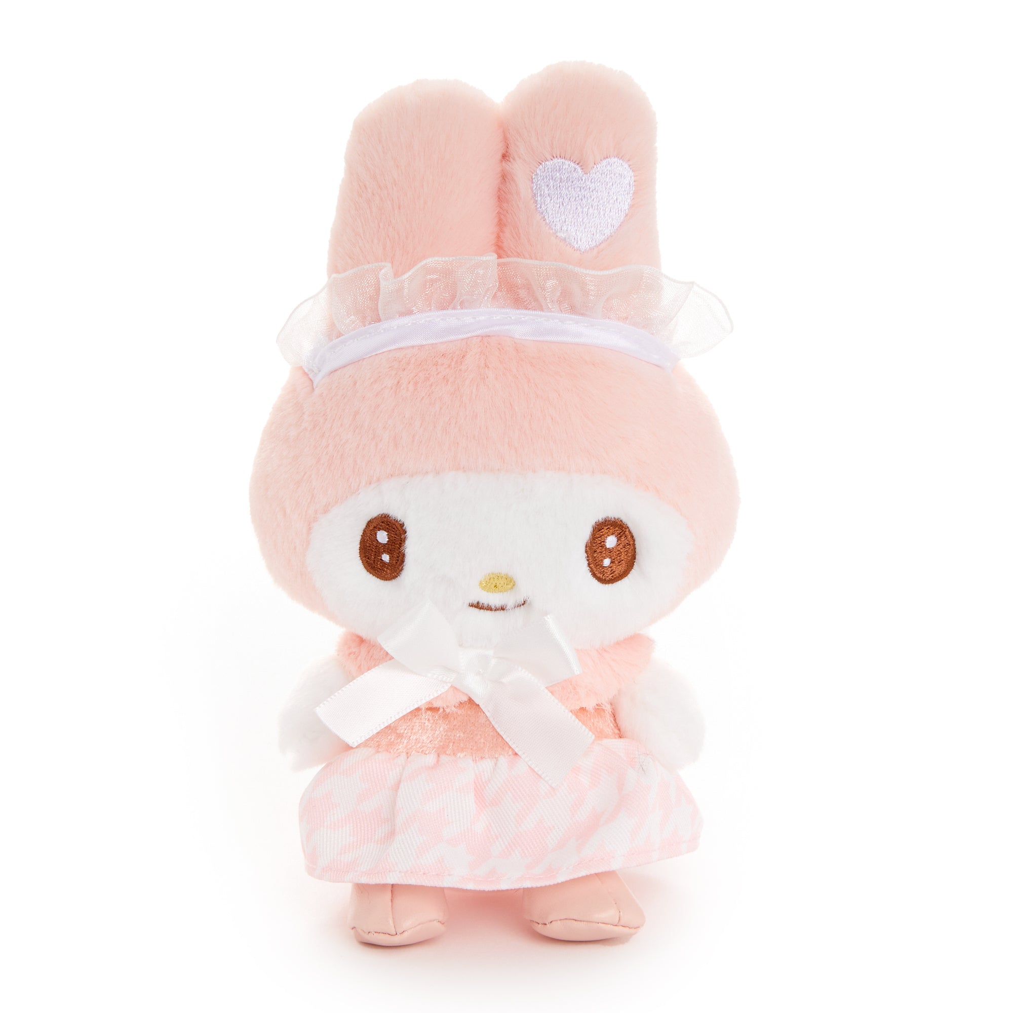 Side angle of My Melody plush charm hanging from a tote on a sunny Florida afternoon