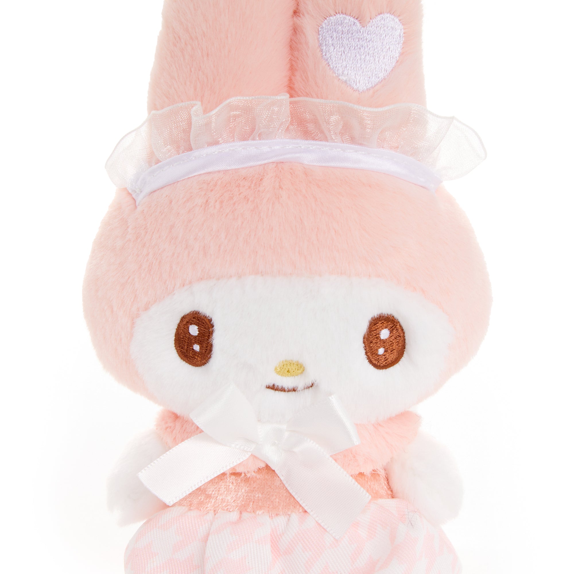 Side angle of My Melody plush charm hanging from a tote on a sunny Florida afternoon